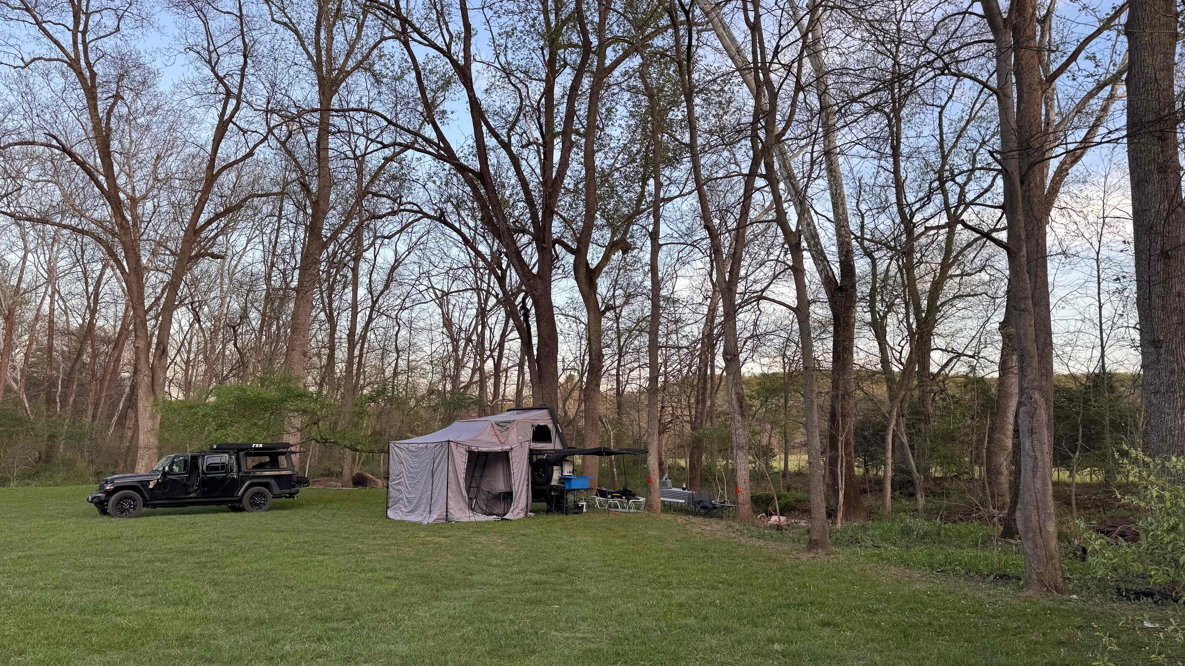 Campsite by the creek. Lots of room and very leveled spot