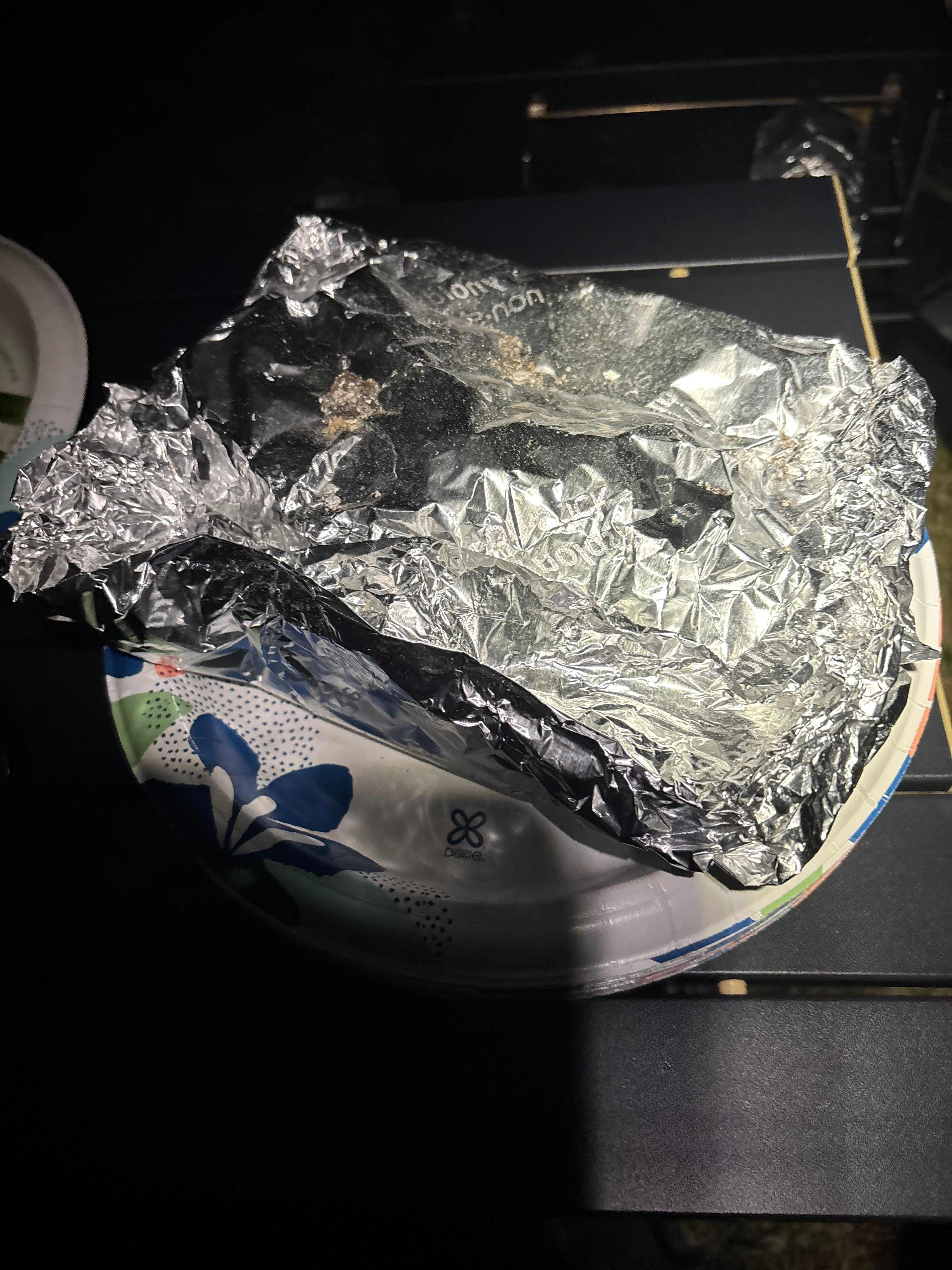 Salmon in foil ready to bake over fire