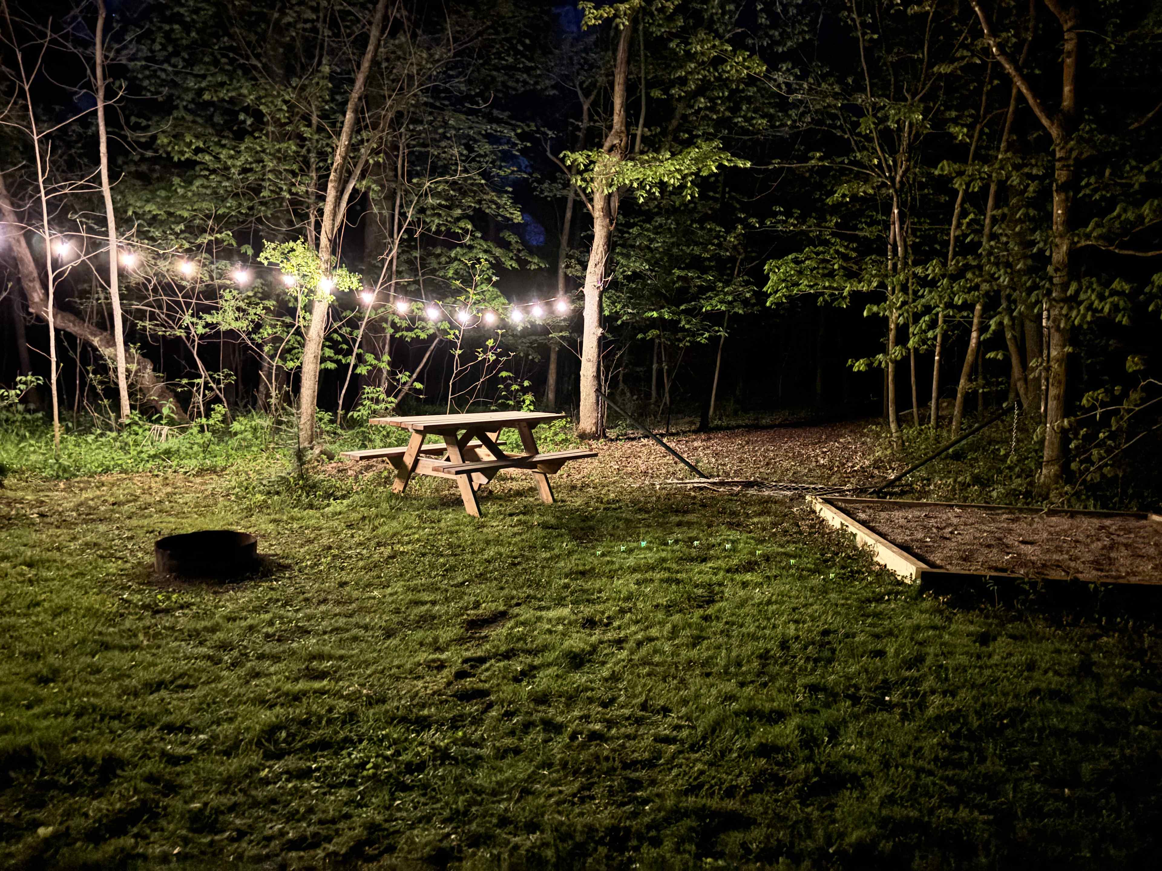 Solar lights, a gravel tent pad, picnic table, hammock, and fire ring are available at your cozy campsite. 
