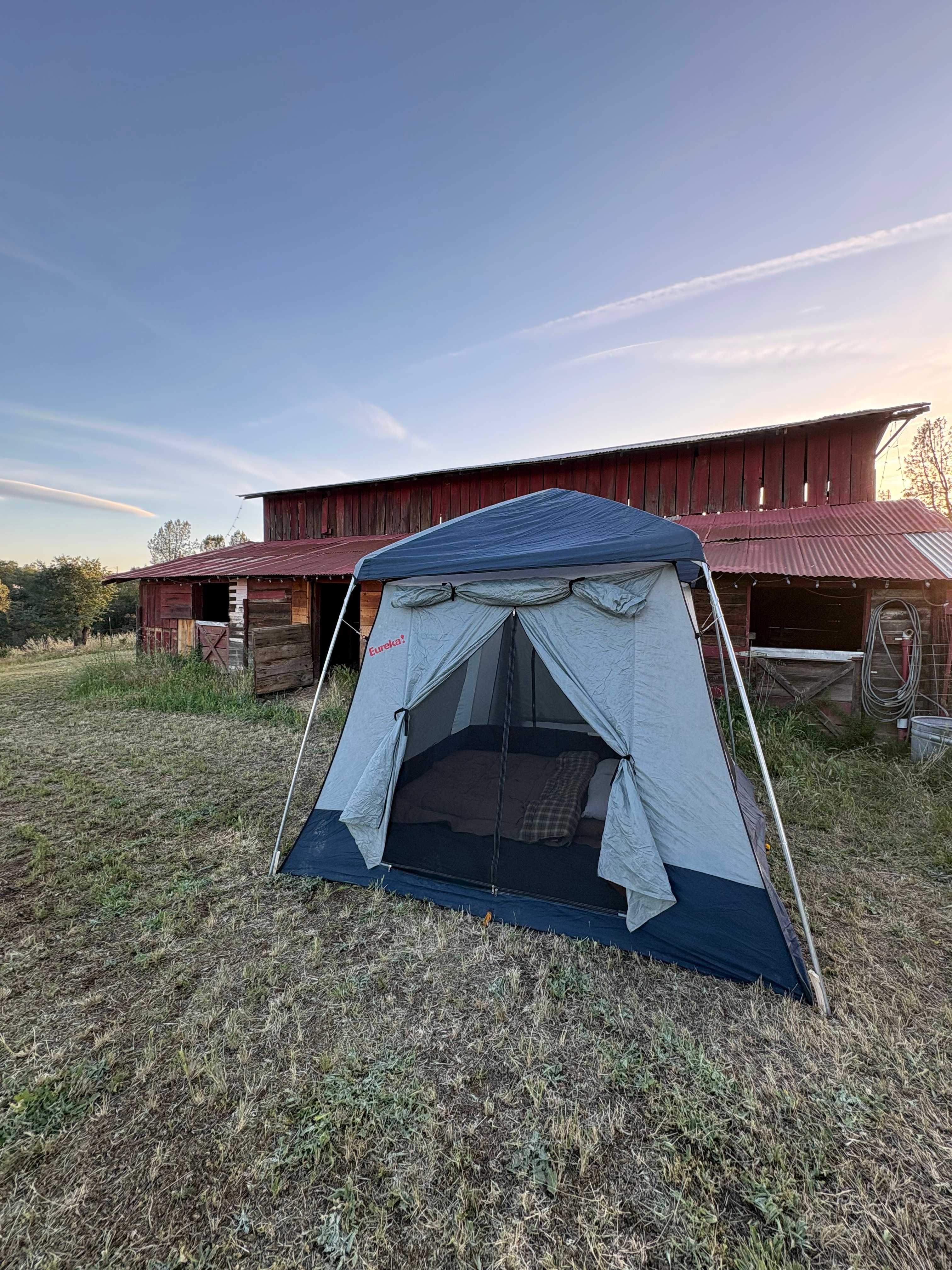 We pitched our tent close to the barn to help block some of the wind 