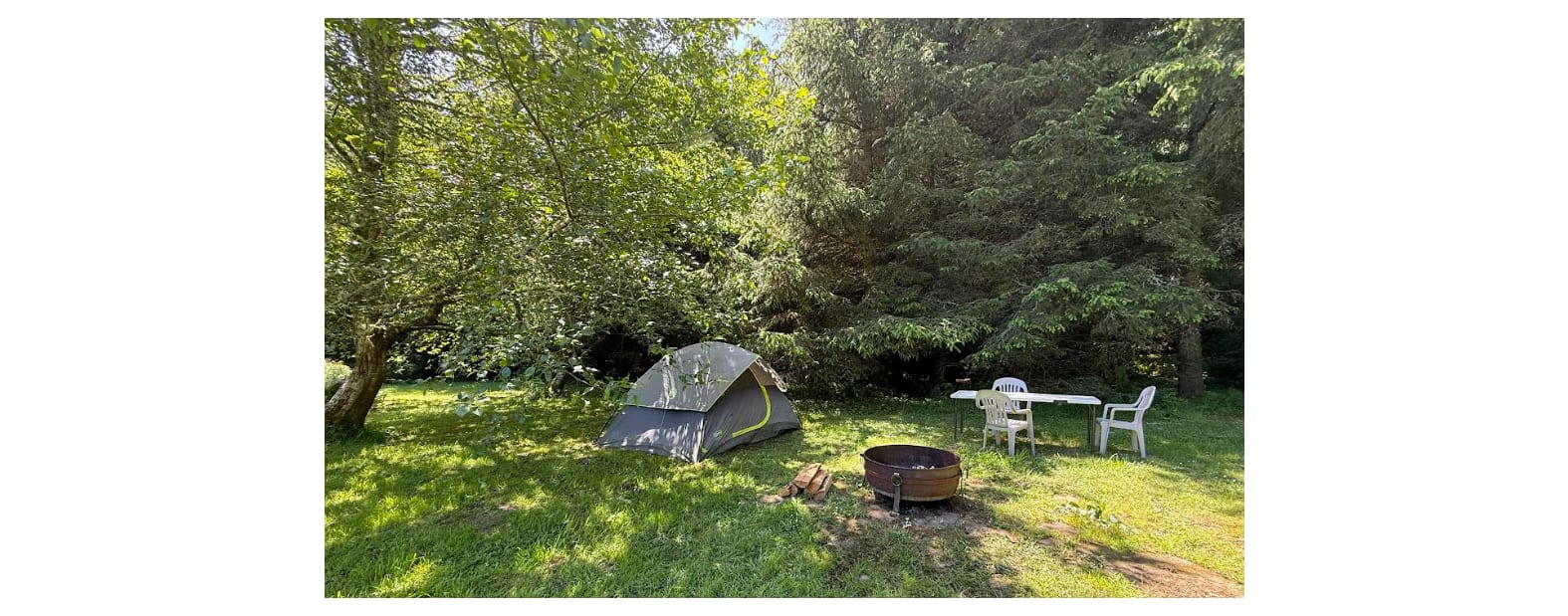 Forest Edge comes with a tent and an inflated queen-sized mattress. We recommend you bring your own bedding, but if that is not possible, we provide comforters and pillows. The fire pit (center) also has firestarters, a torch, and free firewood. 
