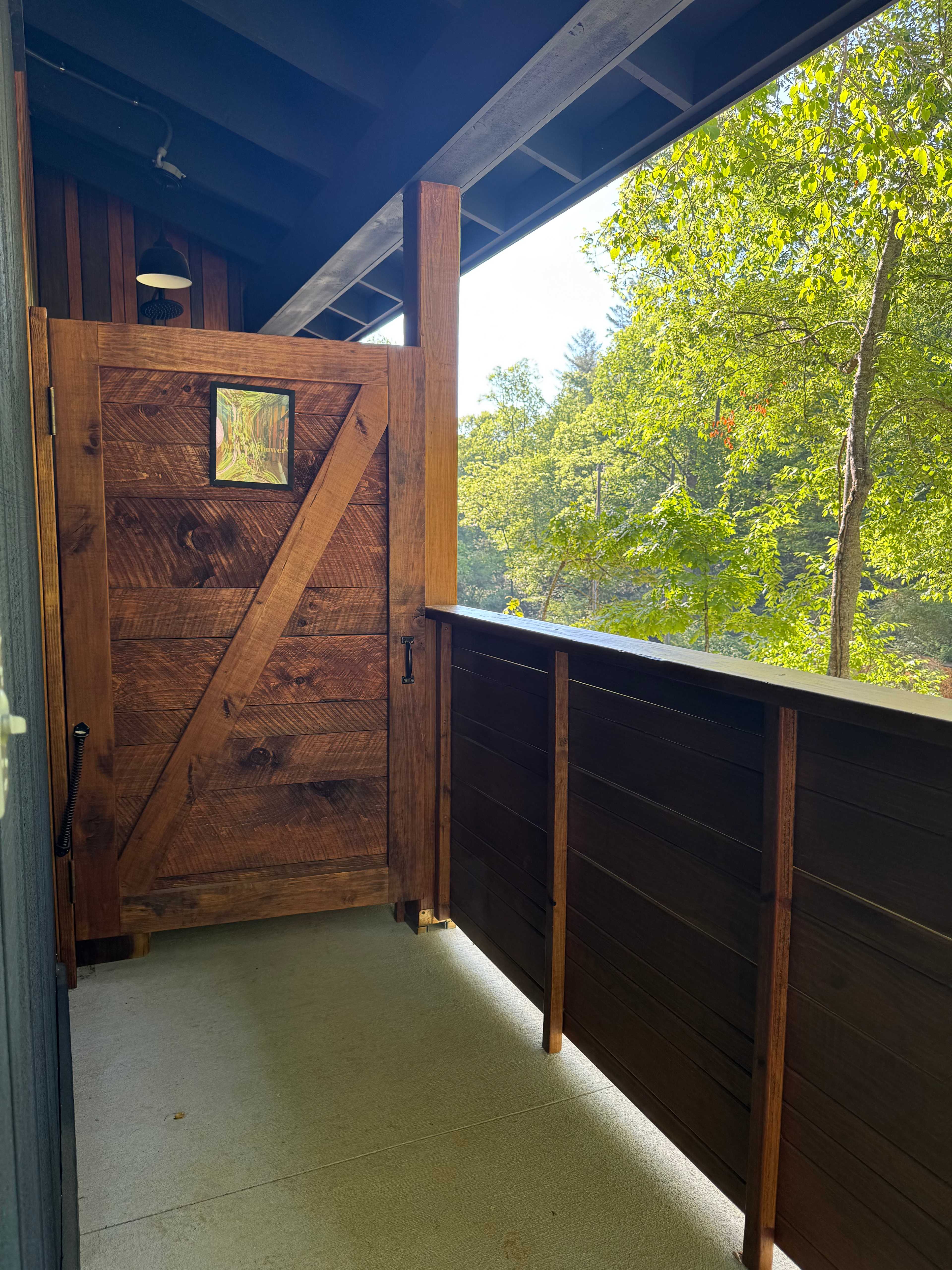 The outdoor shower attached to the very clean bath house
