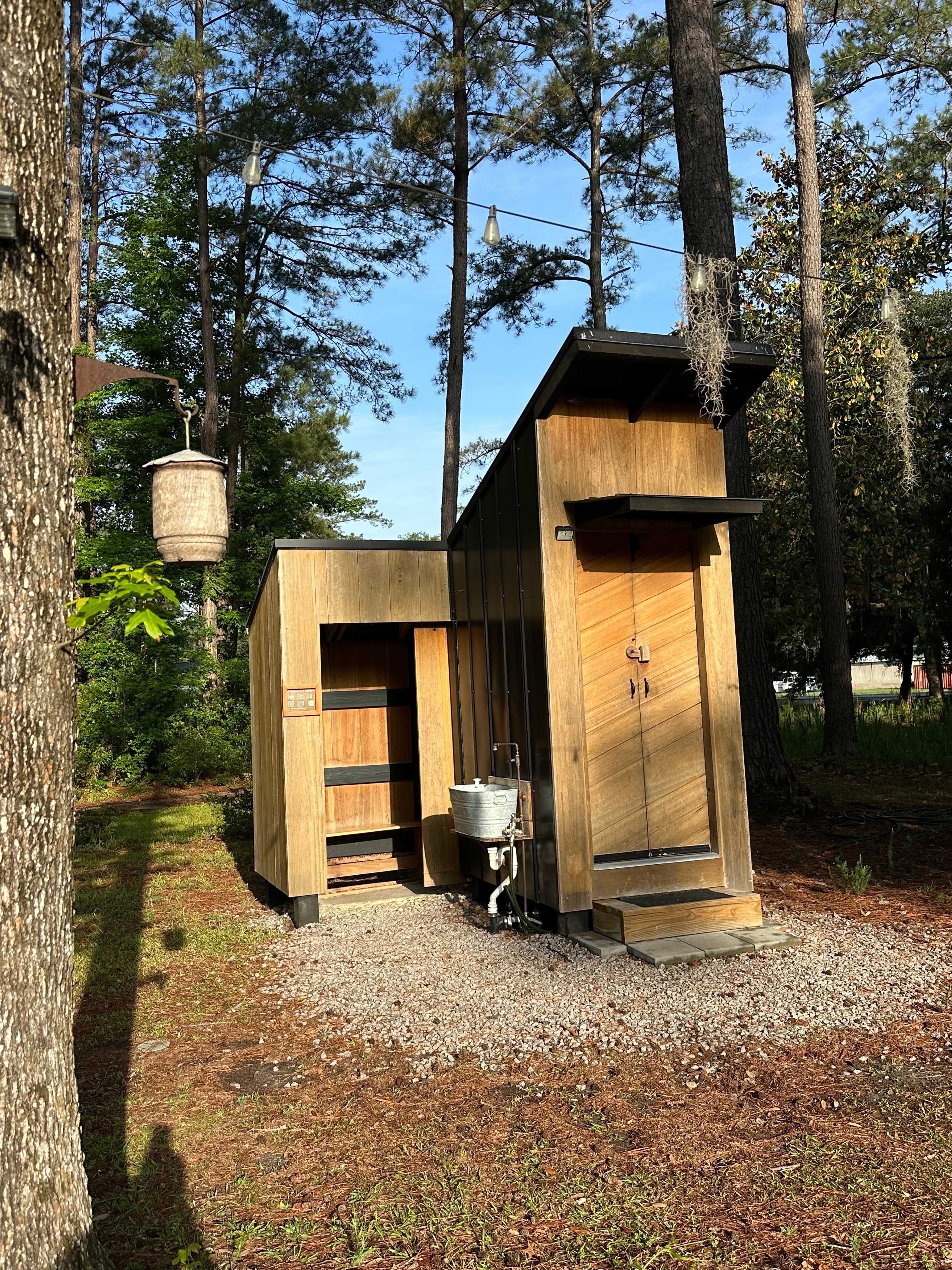 Cutest little water closet  - shower and potty.