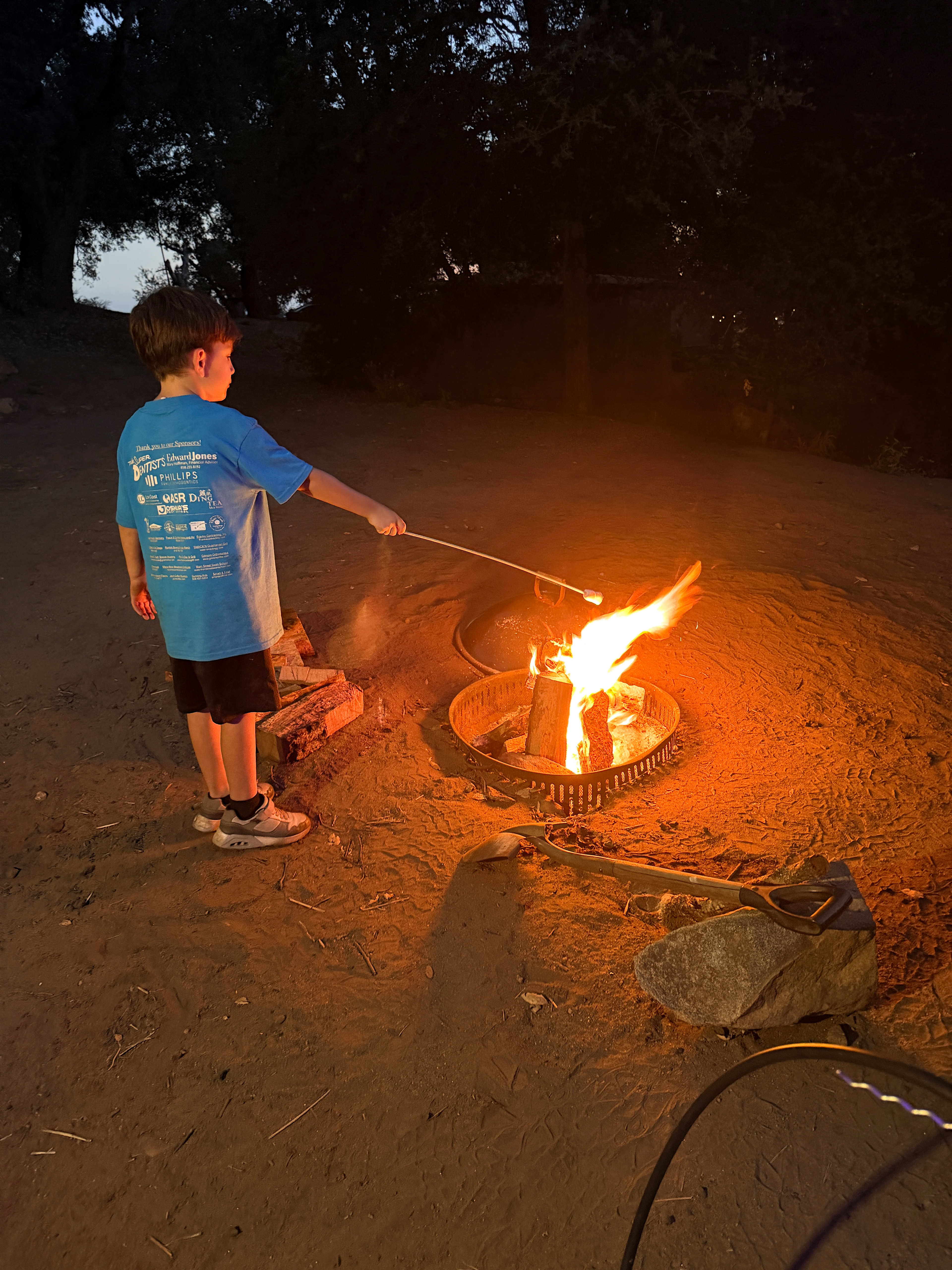 My son making s’mores on the campfire