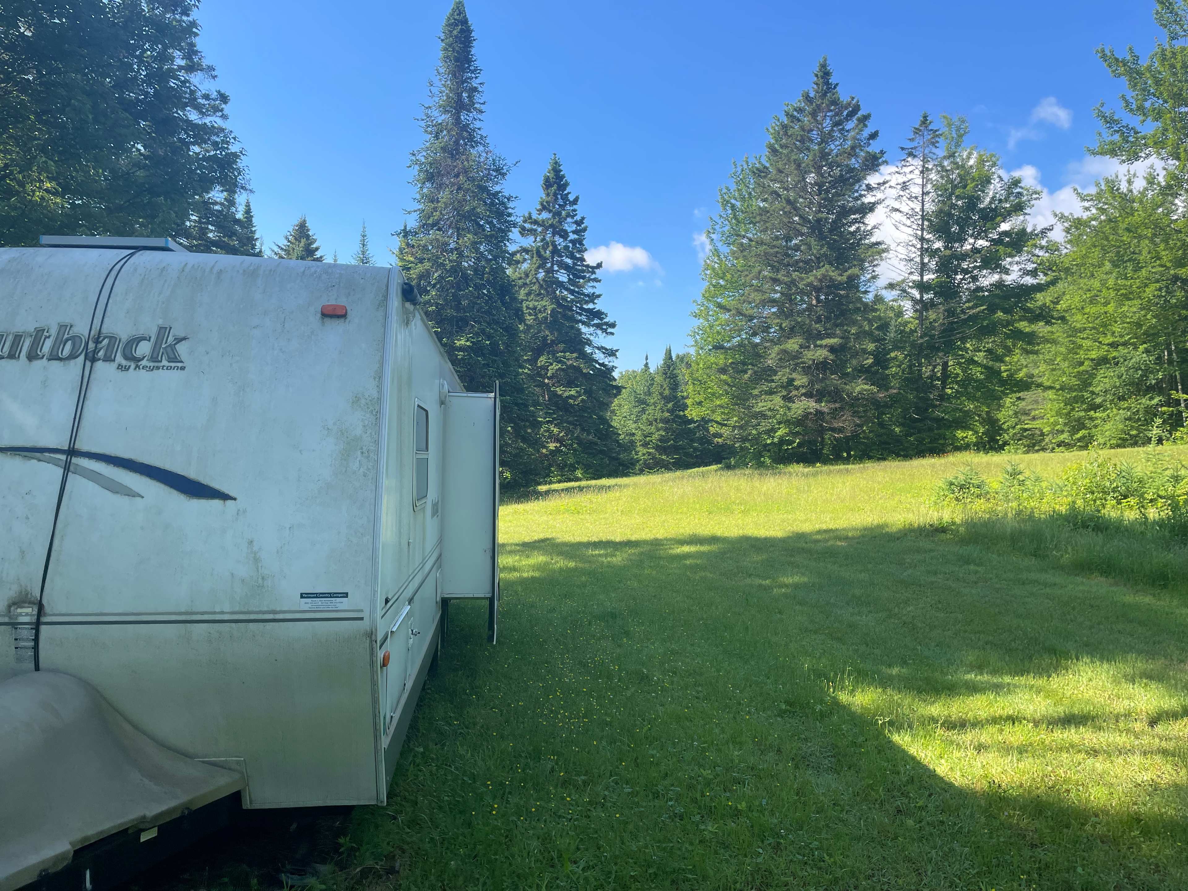 Camper in the woods near swimming