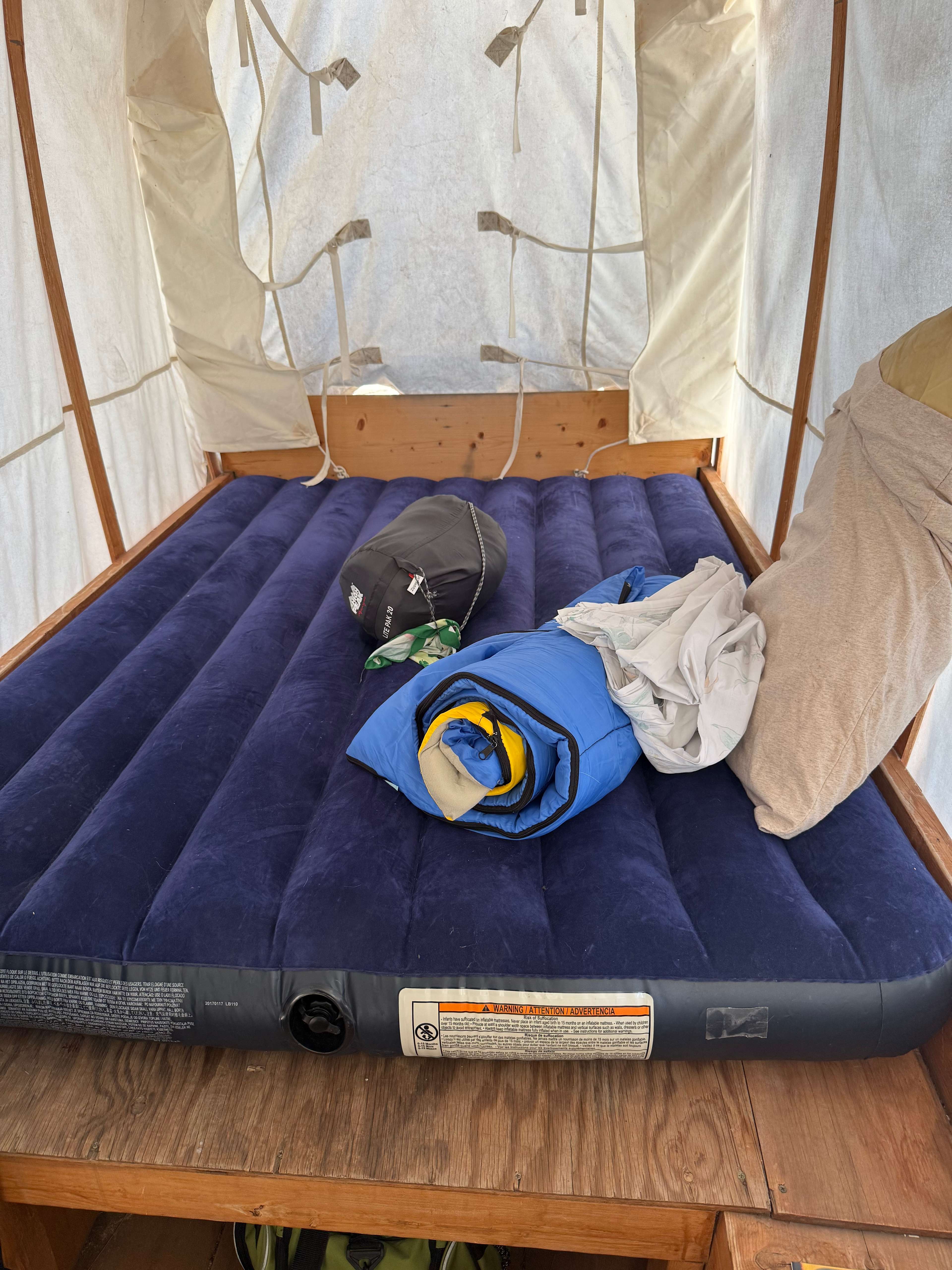 Inside the wagon with our air mattress! Fit a queen!