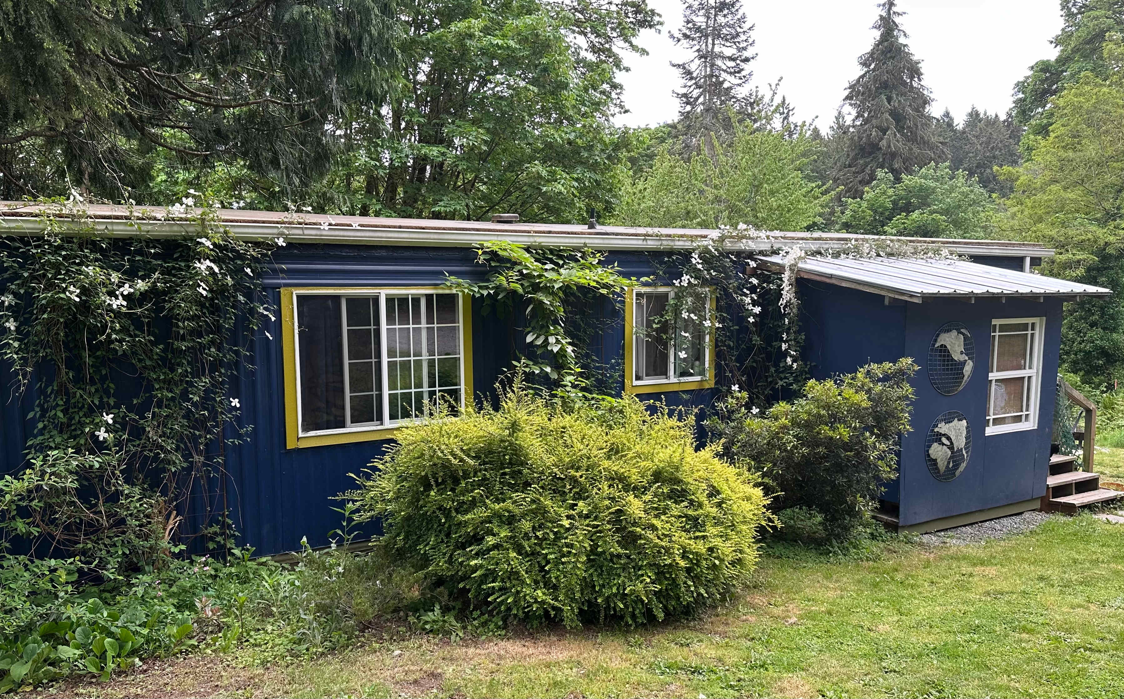 Manufactured home is empty, has shared bathroom and shower to use, wifi, table and chairs, and air conditioning. A caretaker stays in back of house.