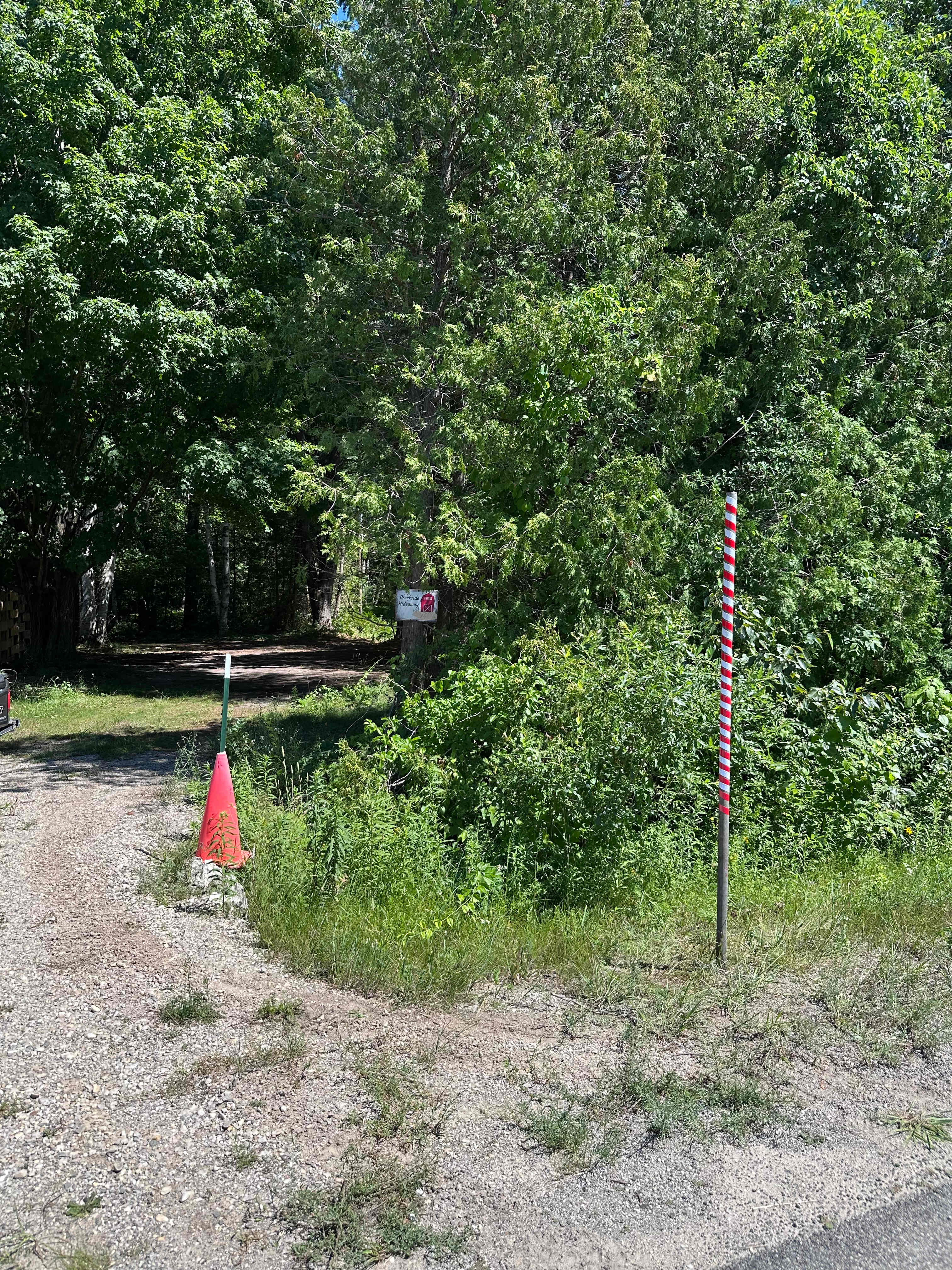 The red and white striped pole indicates the entrance to Creekside Hideaway