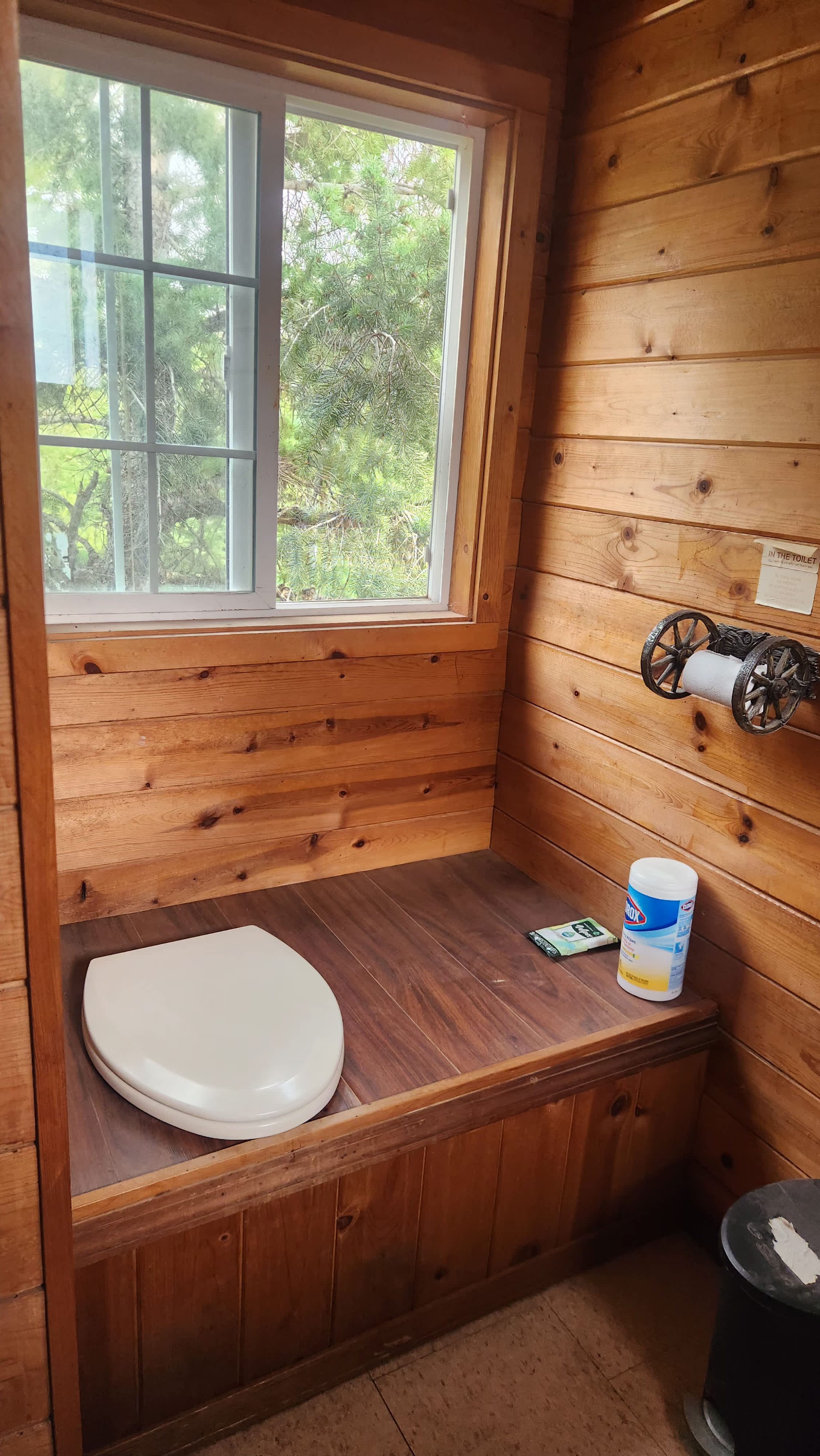 Interior of Outhouse. Pump sink outside. 