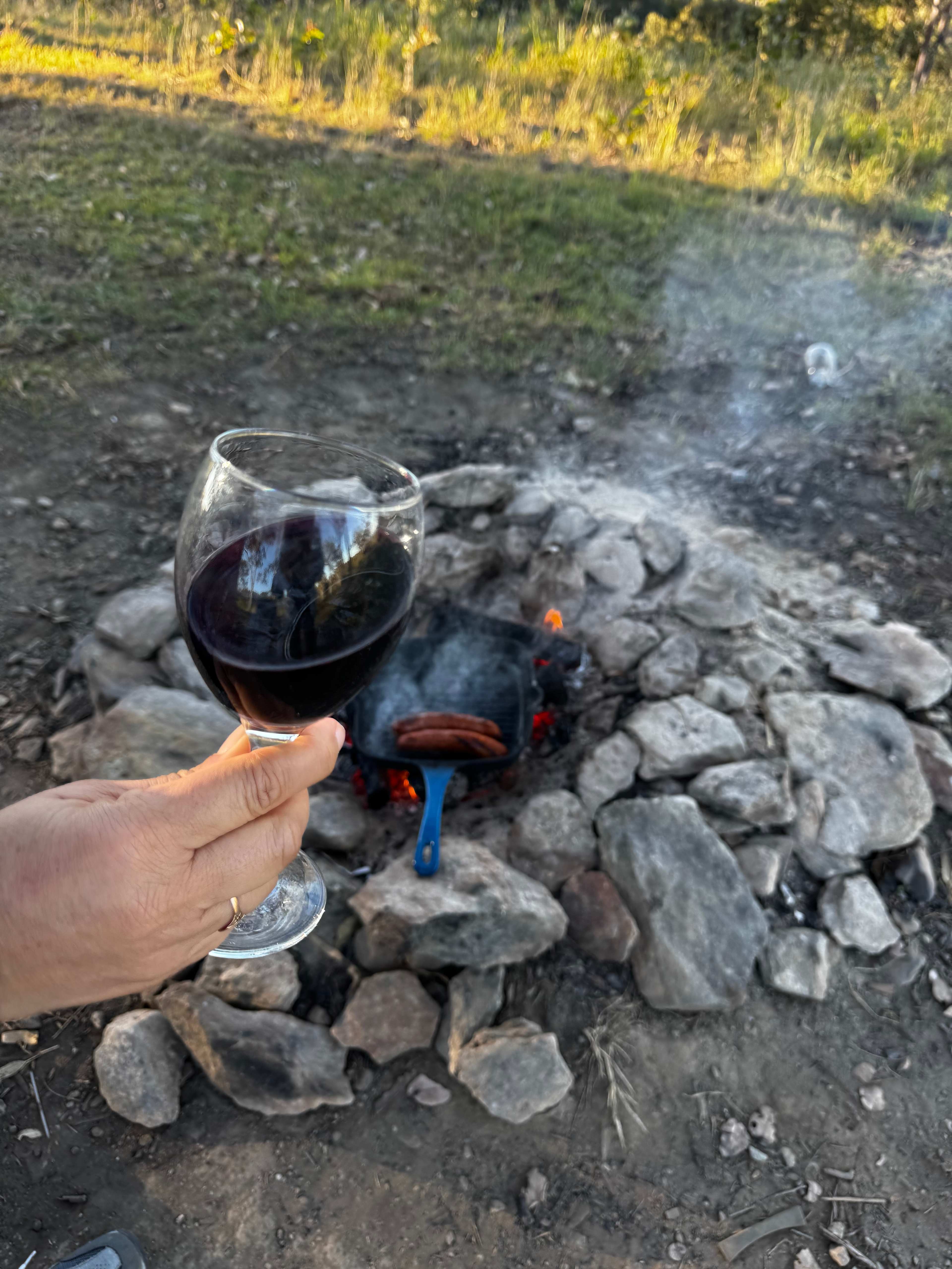enjoying a glass of wine next to the fire. 