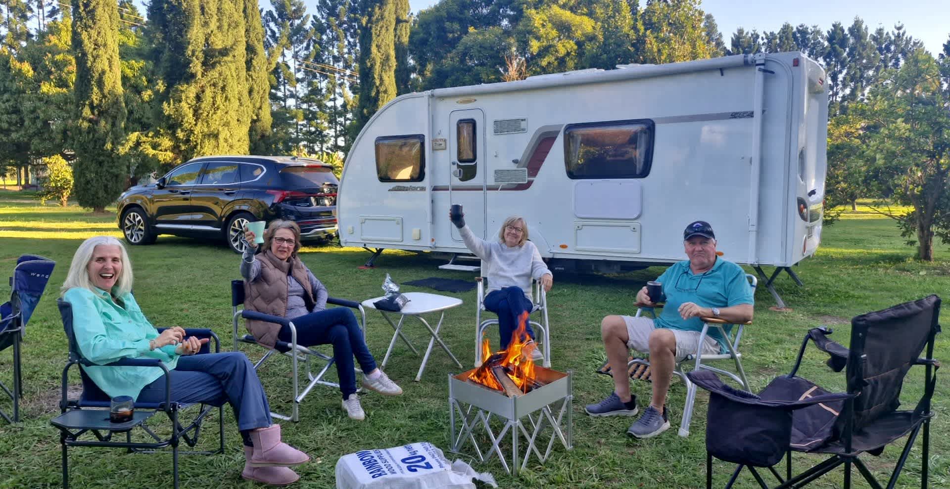 Warming up around the fire after enjoying a beer in the pub.