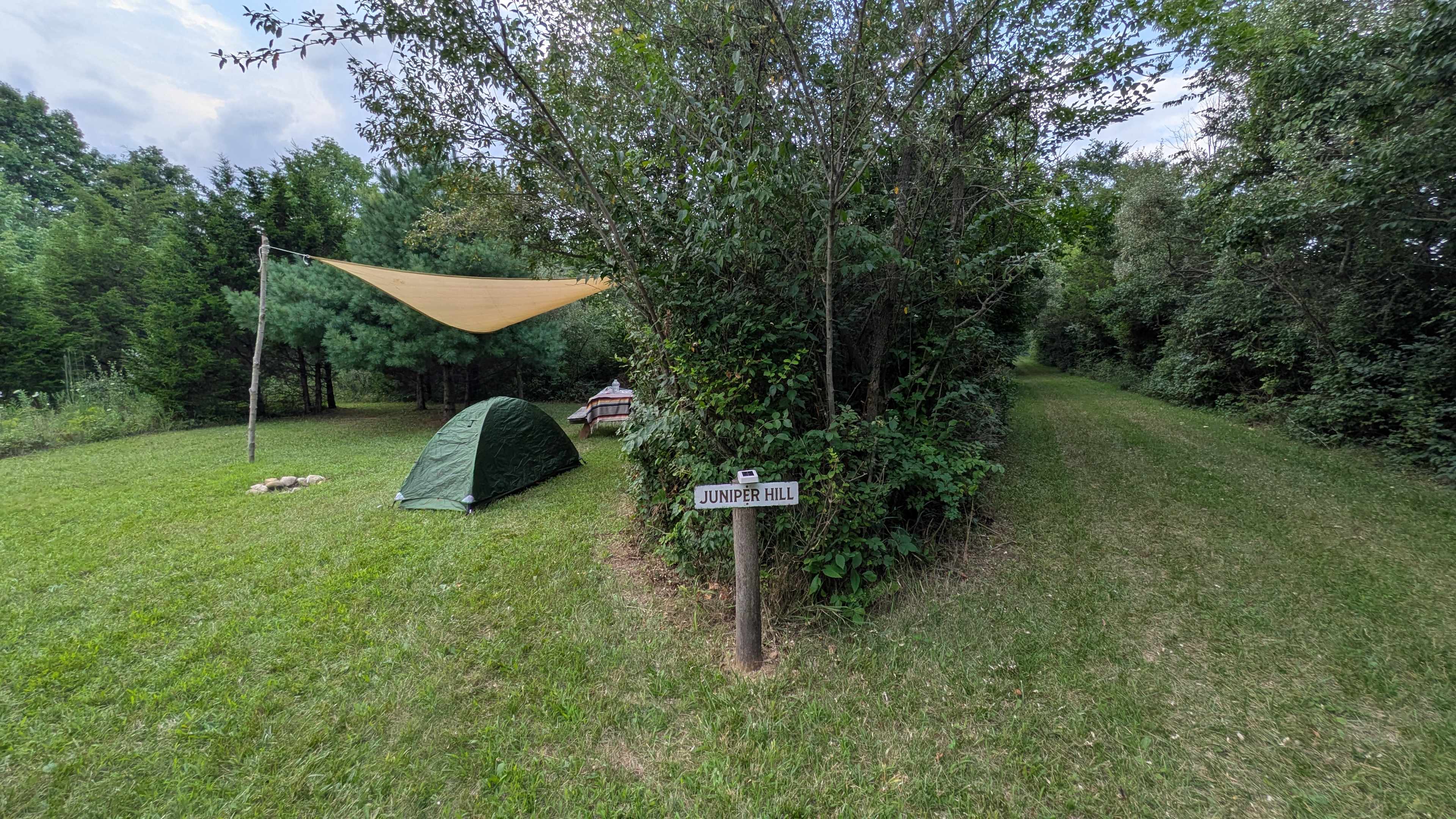 Site entrance, the road is to the right. 