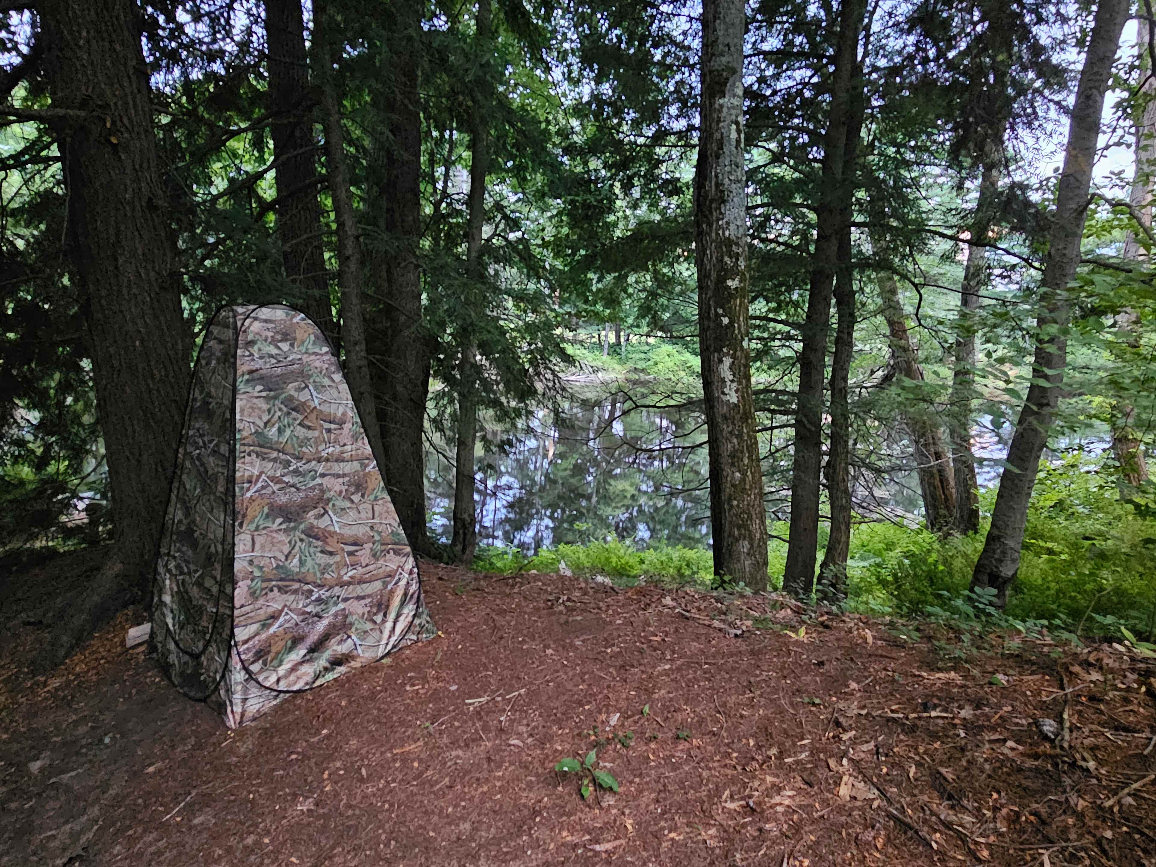 Privacy tent with cedar chip toilet