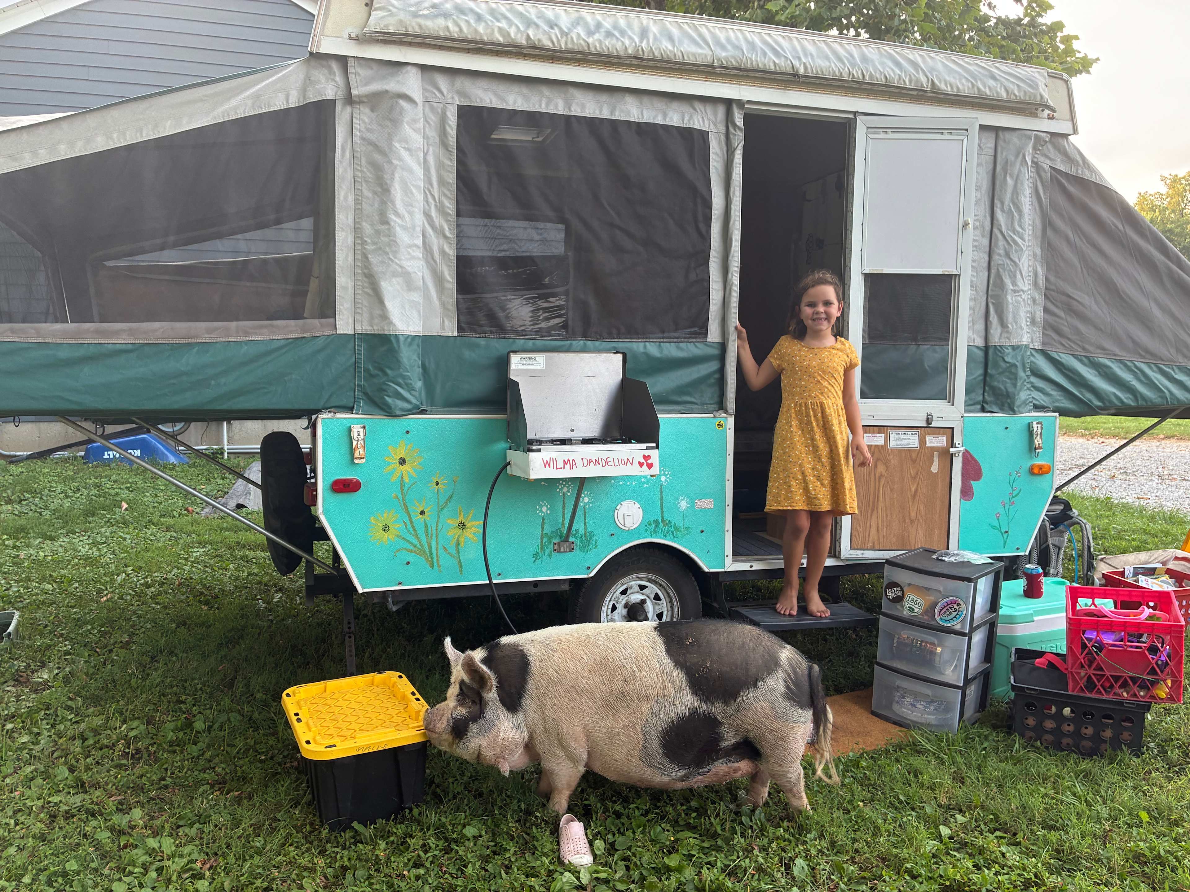 Birthday girl and Lulu by our camper!