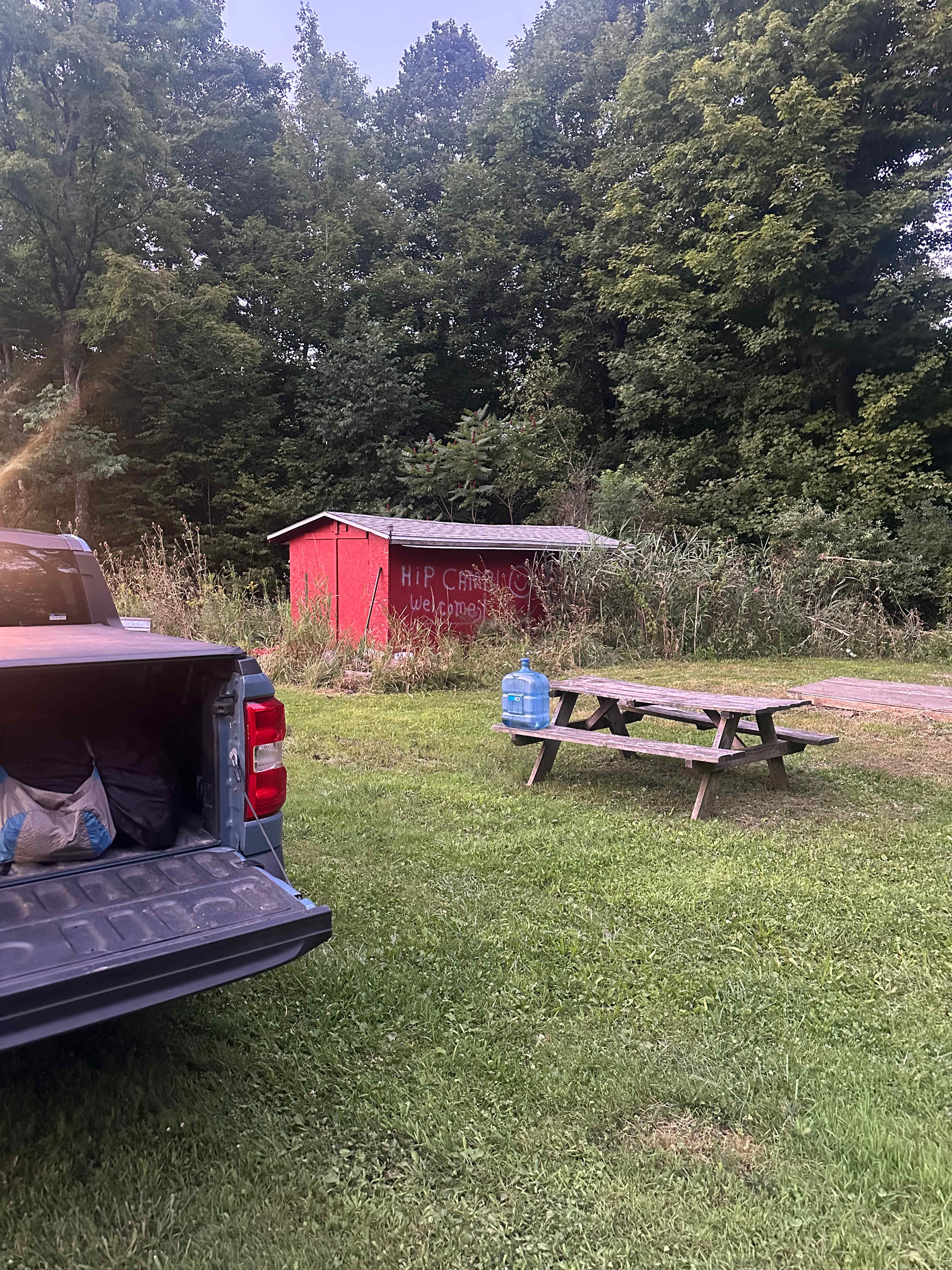 I wish I got more/better pictures, but this was right by the entrance. There was a picnic table, tent pad, fire ring, and firewood. To the left of this picture was a large grass field with a couple paths leading into the woods.