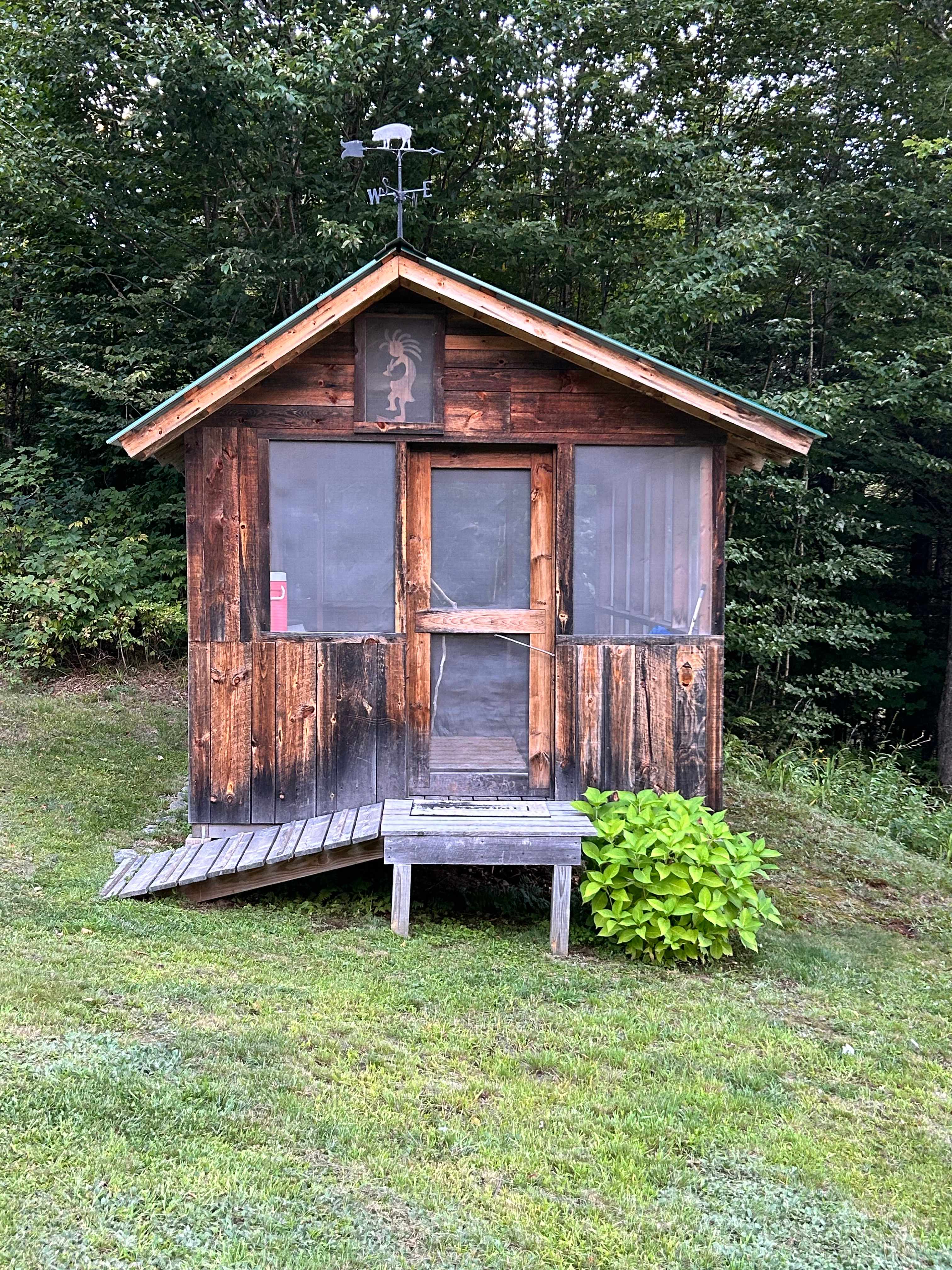 Enclosed porch with table and chairs 