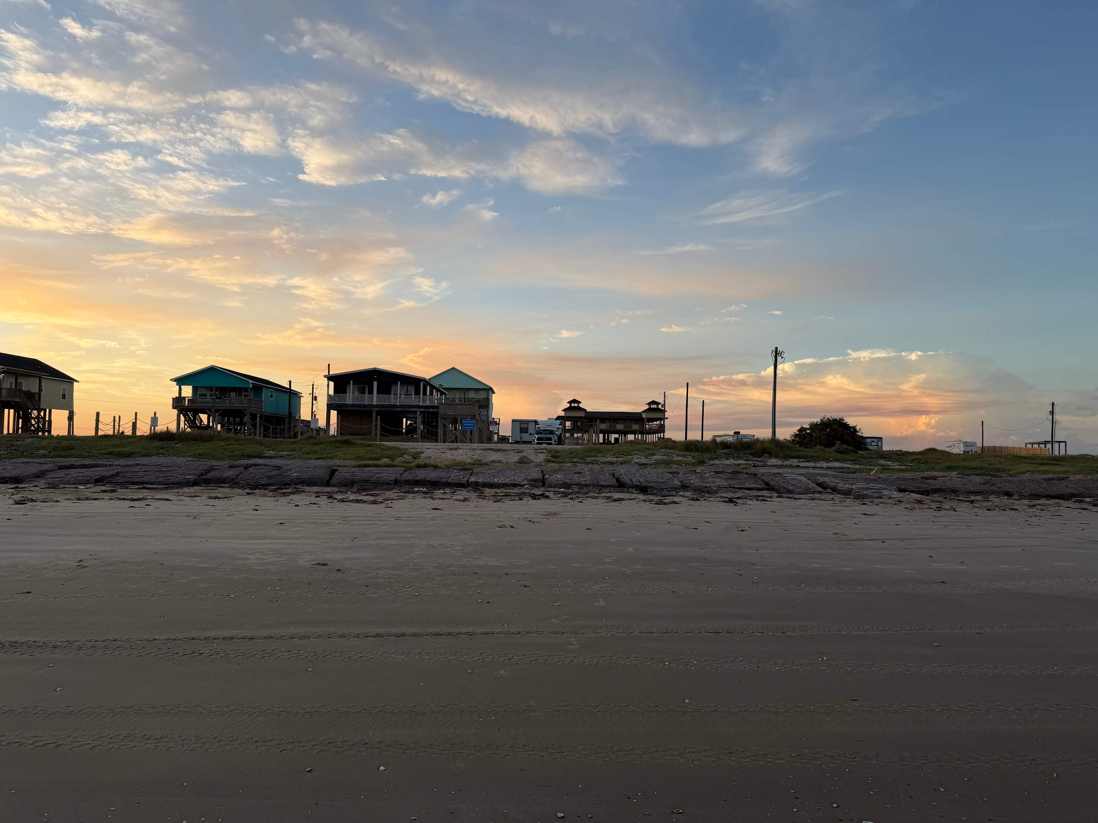 Standing in the ocean, looking at our camper