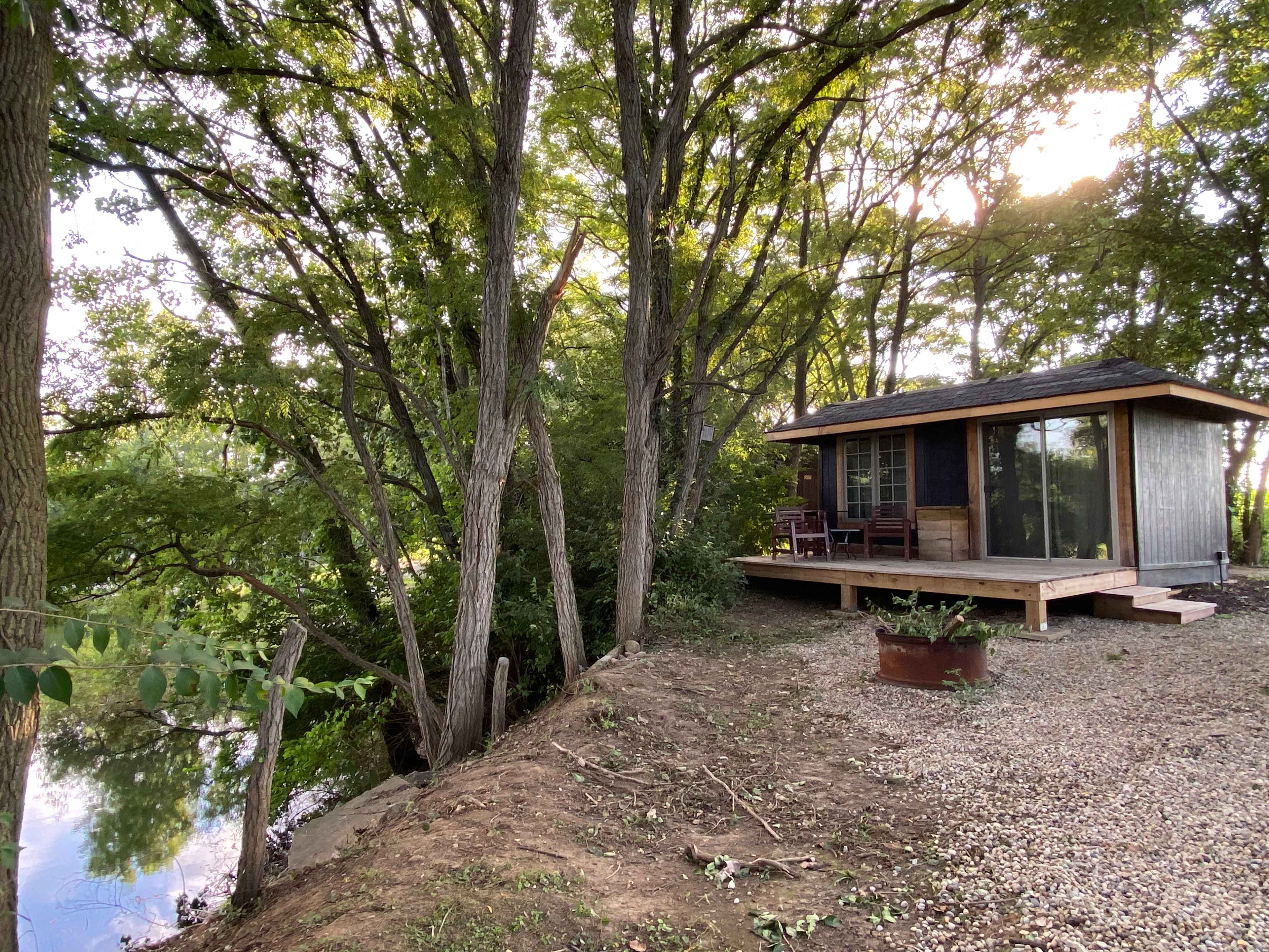 The Hollow sits high above the Cattail Springs pond and has access to the pond via steps down the hill.