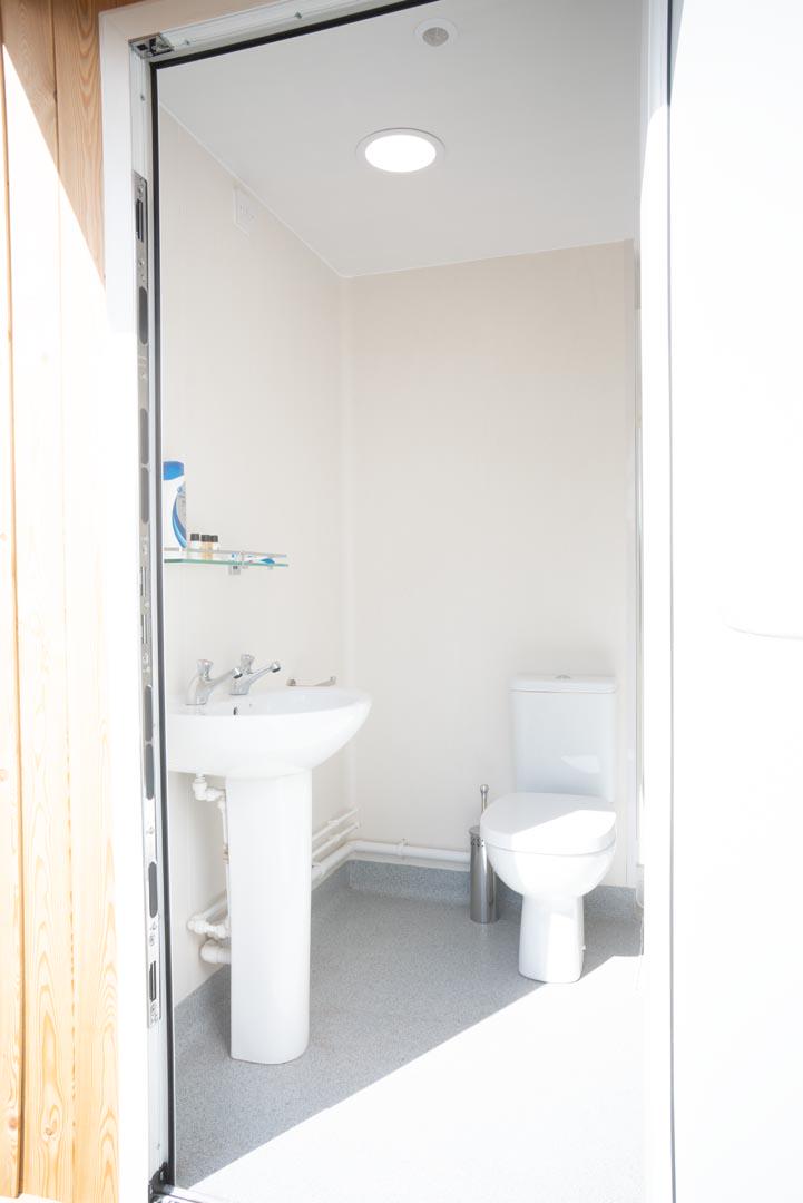 Each safari tent has its own pitch pod with a loo, sink and shower.