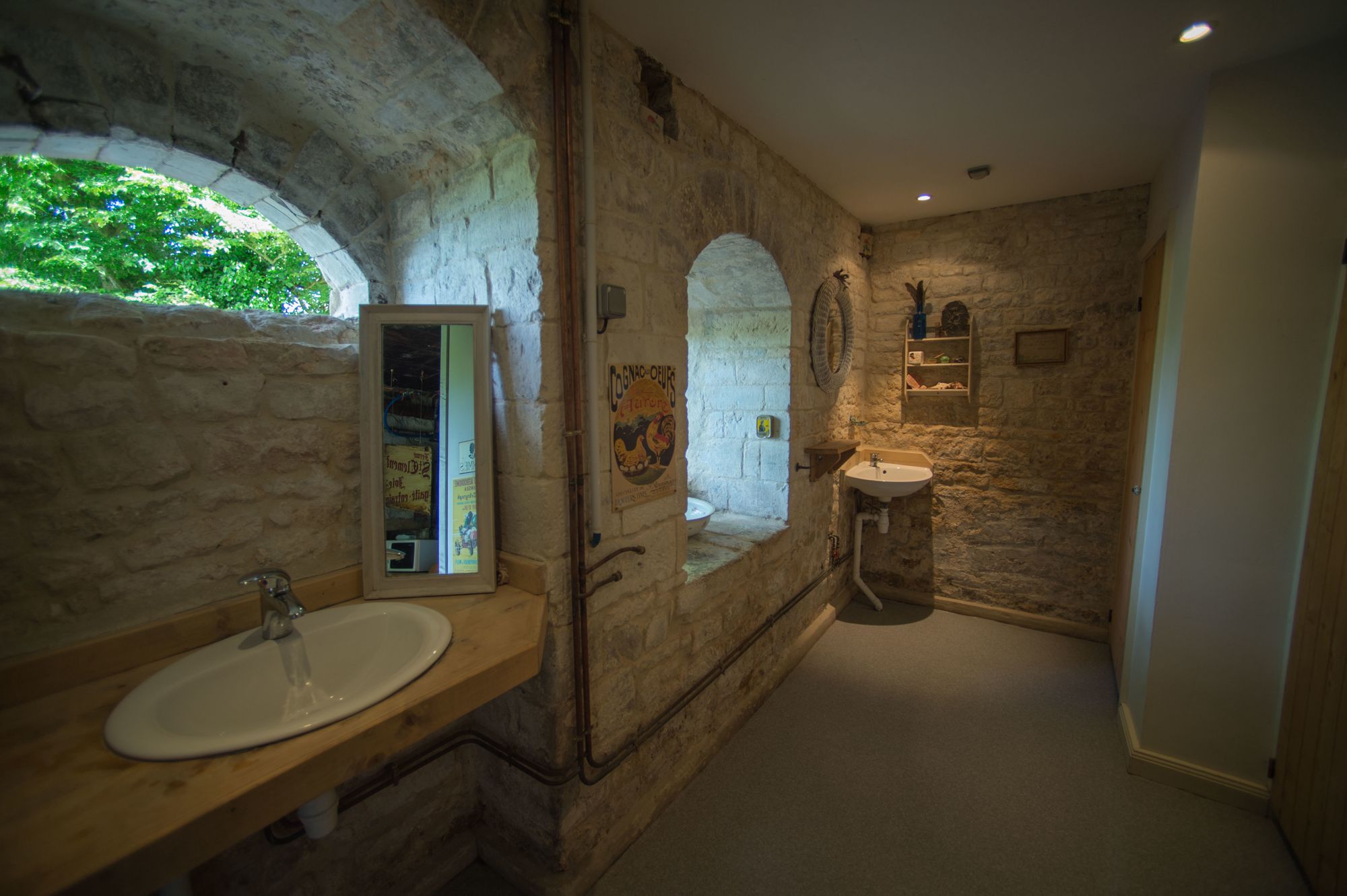 In the grounds of a thousand year old château commissioned by William the Conqueror, lies a brilliant family campsite with a limited number of pitches, a natural swimming pond and a vintage tractor that trundles you to and from your tent.