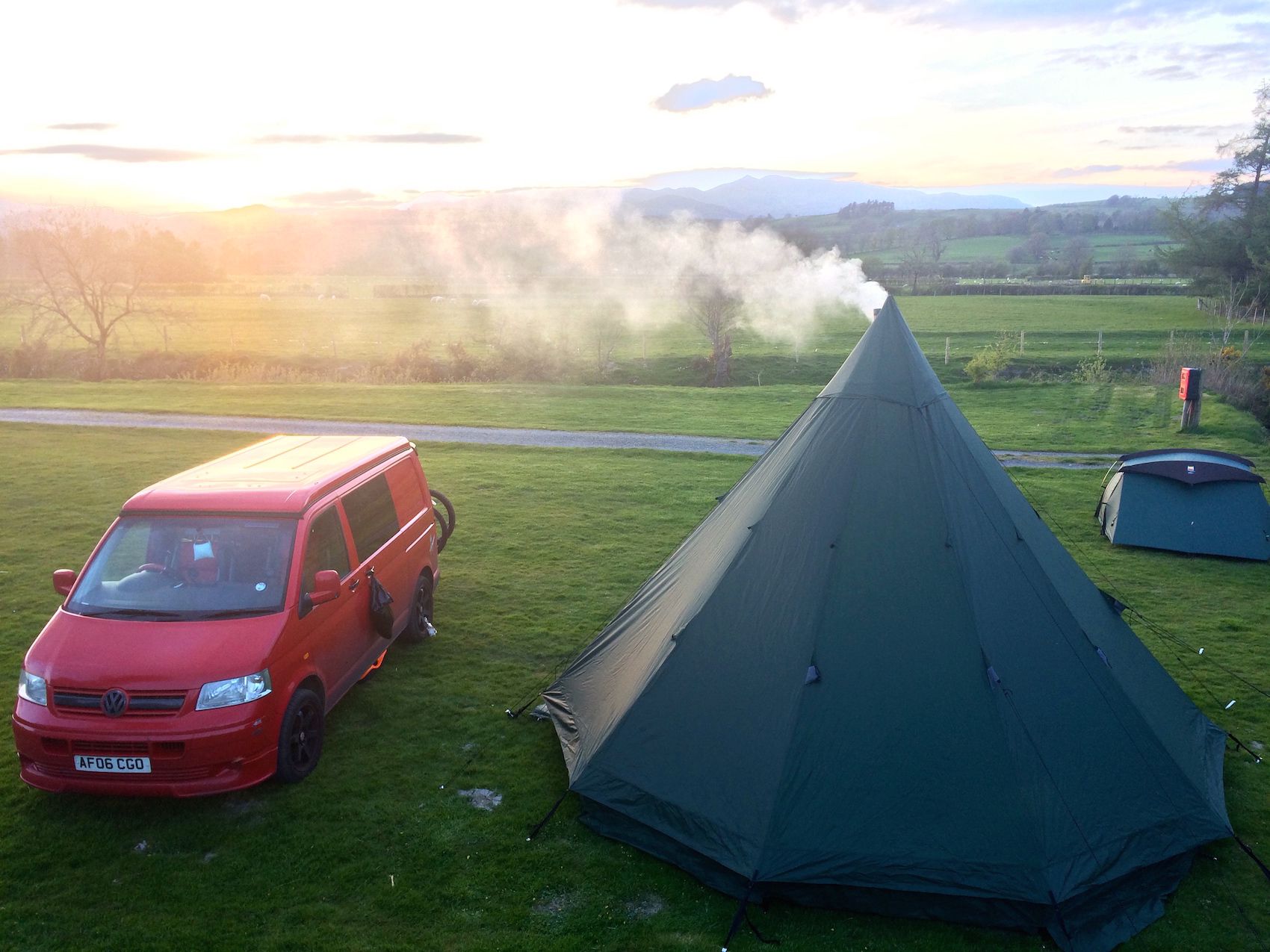 Riverside camping in a quiet village at the end of Bala Lake, right next door to a volunteer-run steam railway.