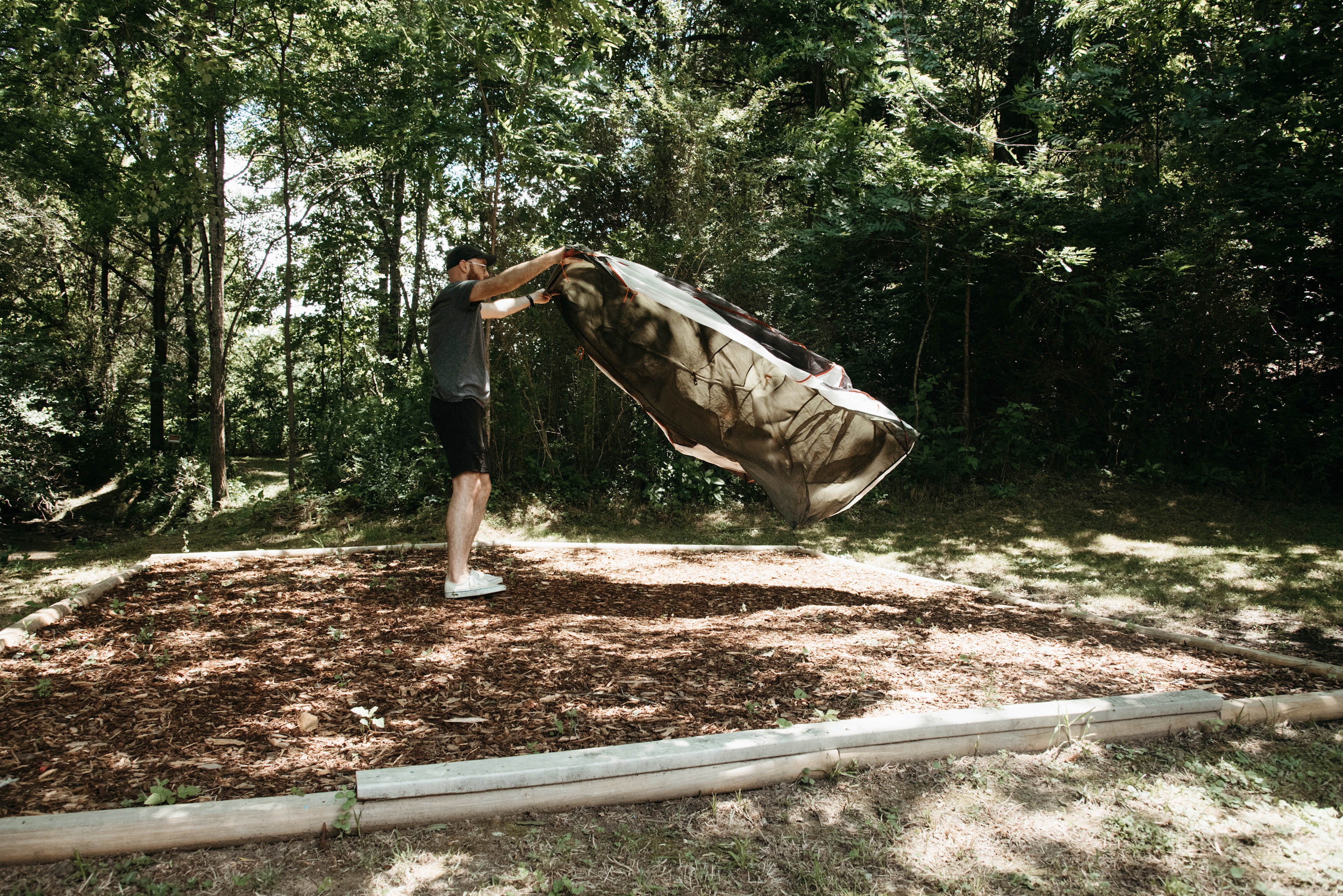 Setting up the tent on the tent platform.