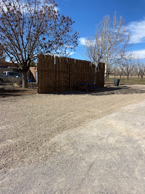 Privacy fence installation in progress between Site 1 and Residence