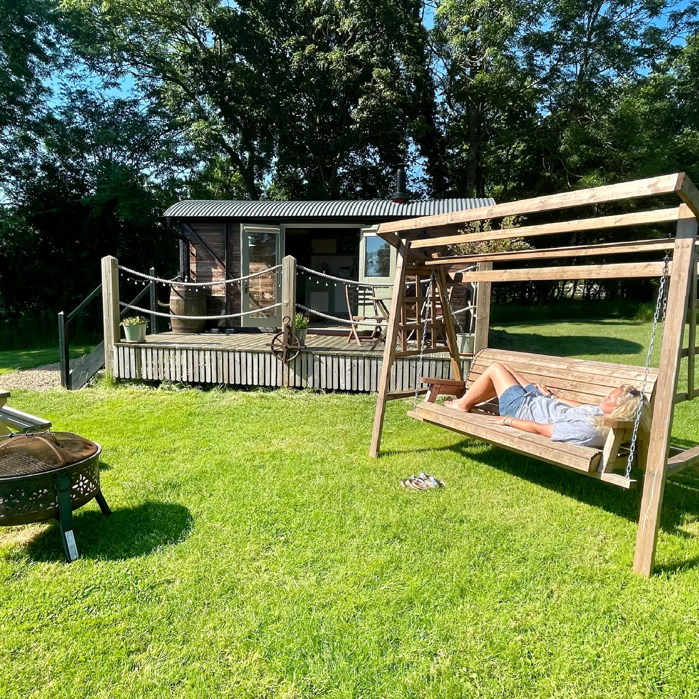 Victoria and the outside area with swing seat and BBQ.