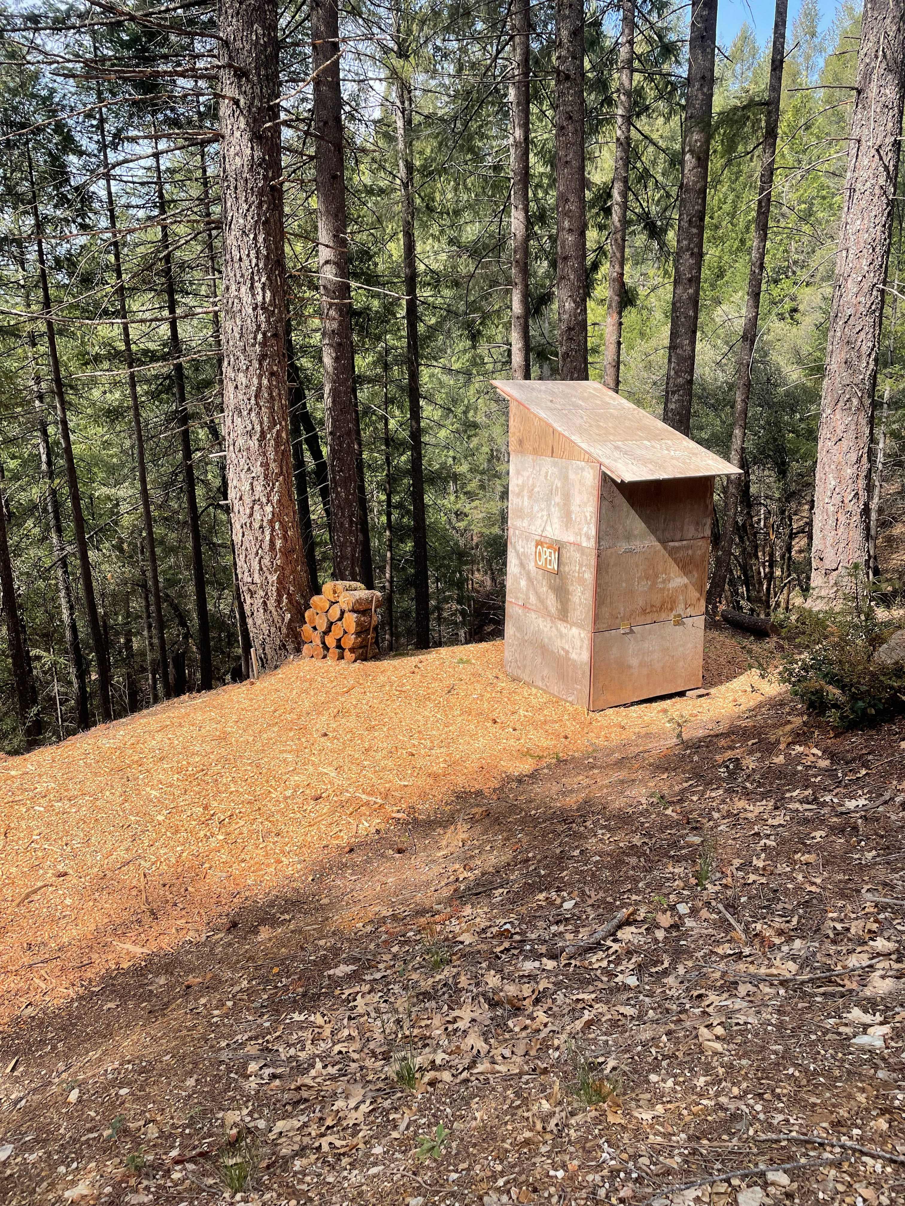 Compost toilet overlooking forest. 