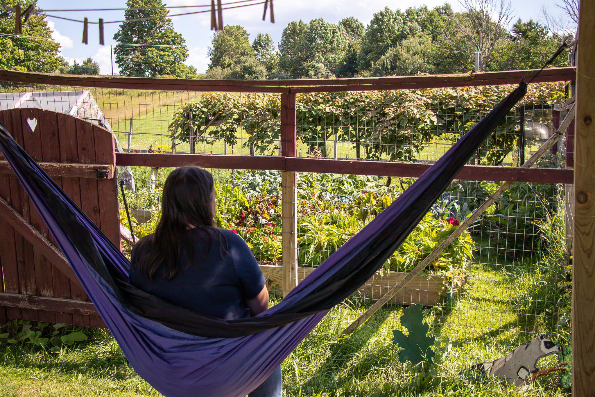 The hammock under the tree house has a beautiful view of the garden