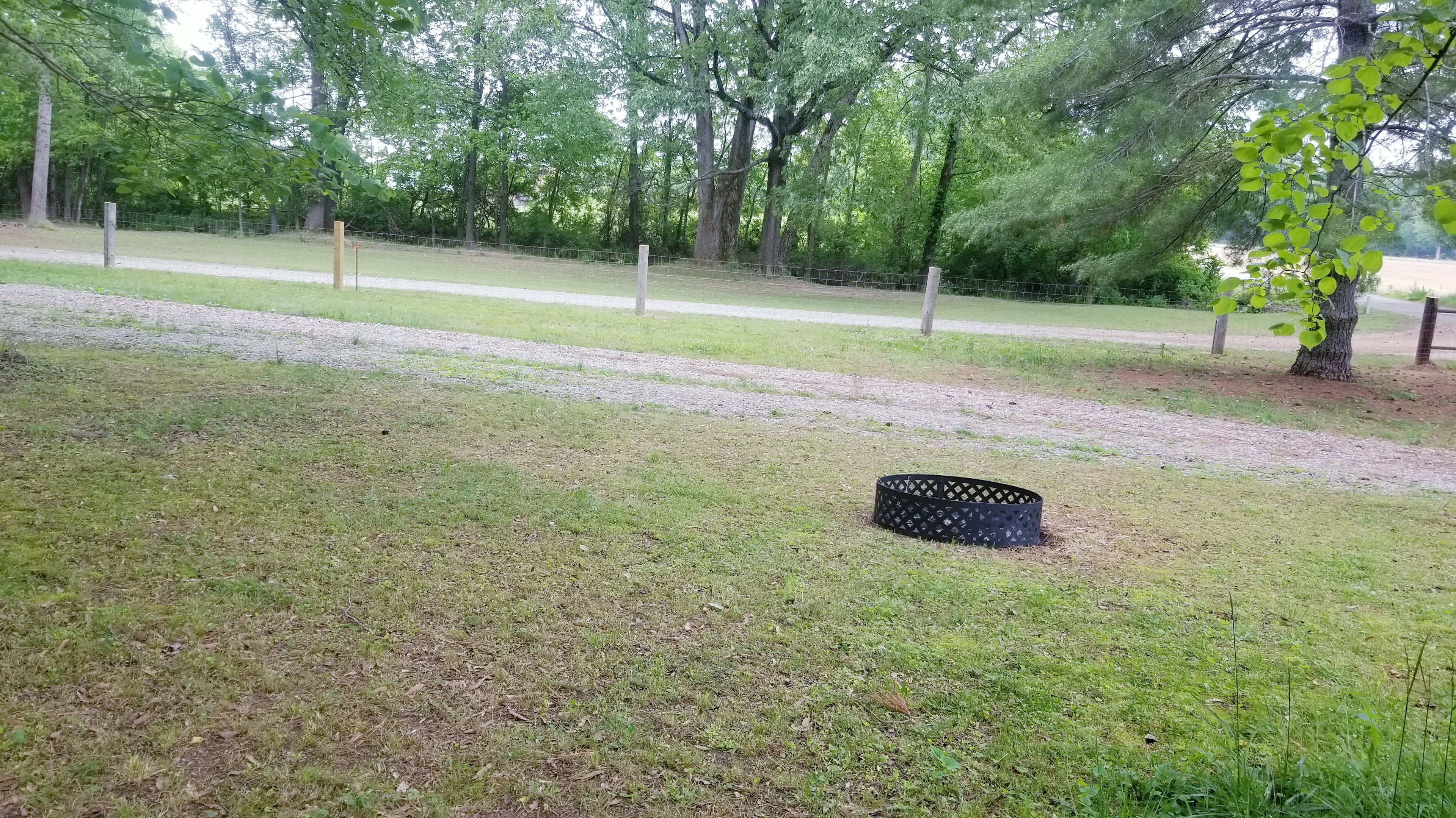 Rv spot #3 (45 ft) with fire pit for your use during your stay as well as complimentary firewood.  