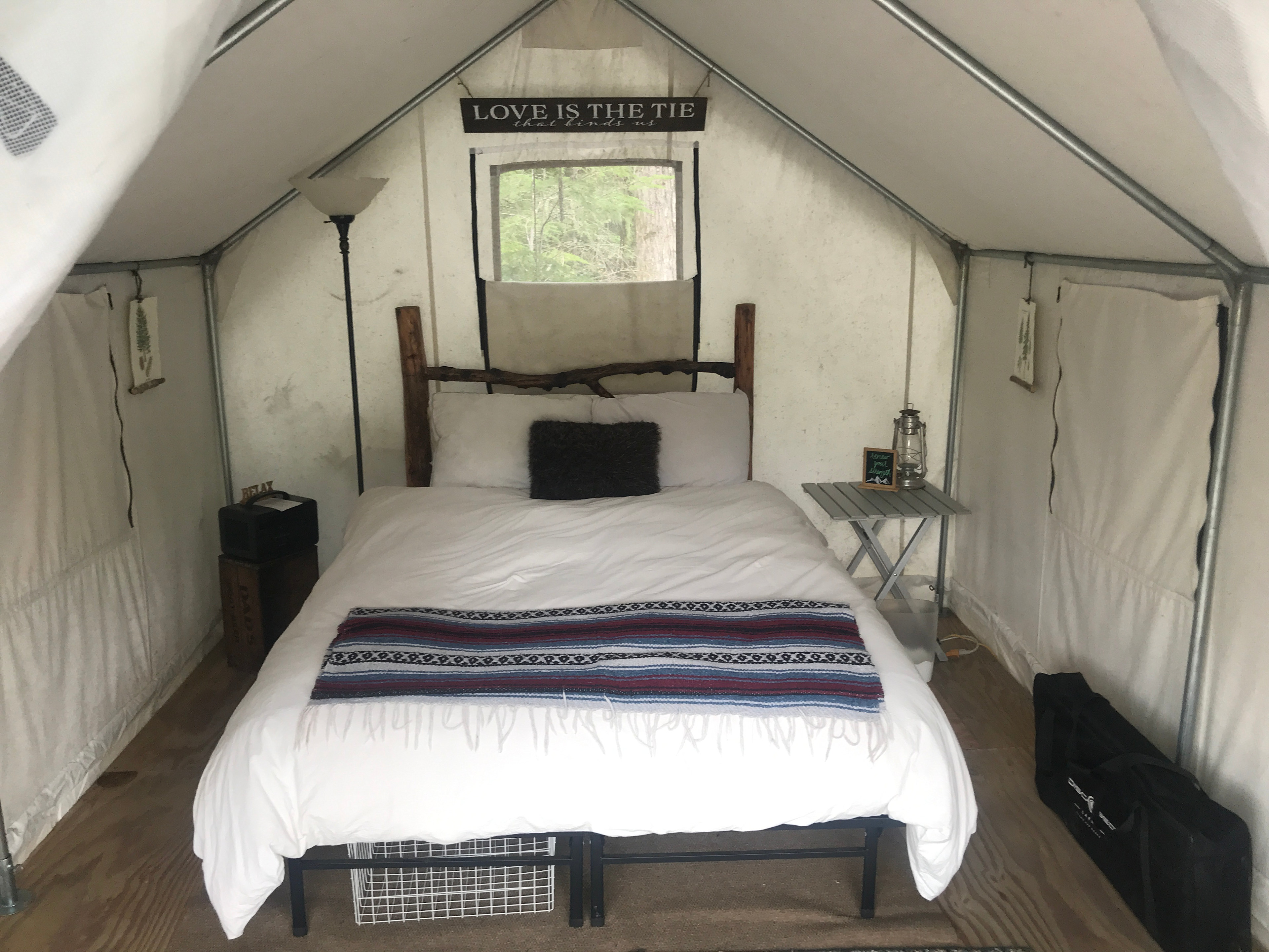 With room for one cot at foot of bed
