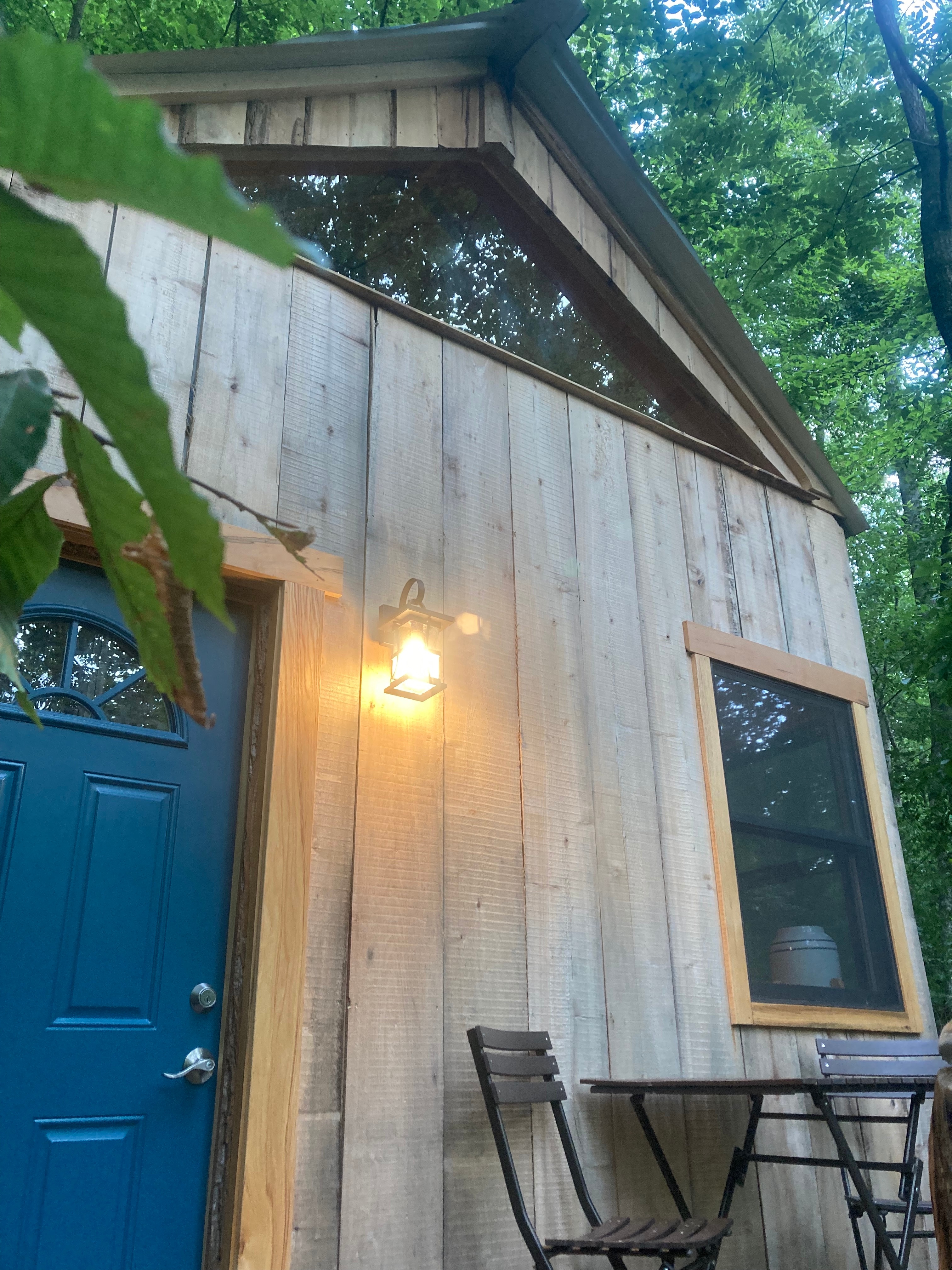 Relax in the trees on this front porch! 
