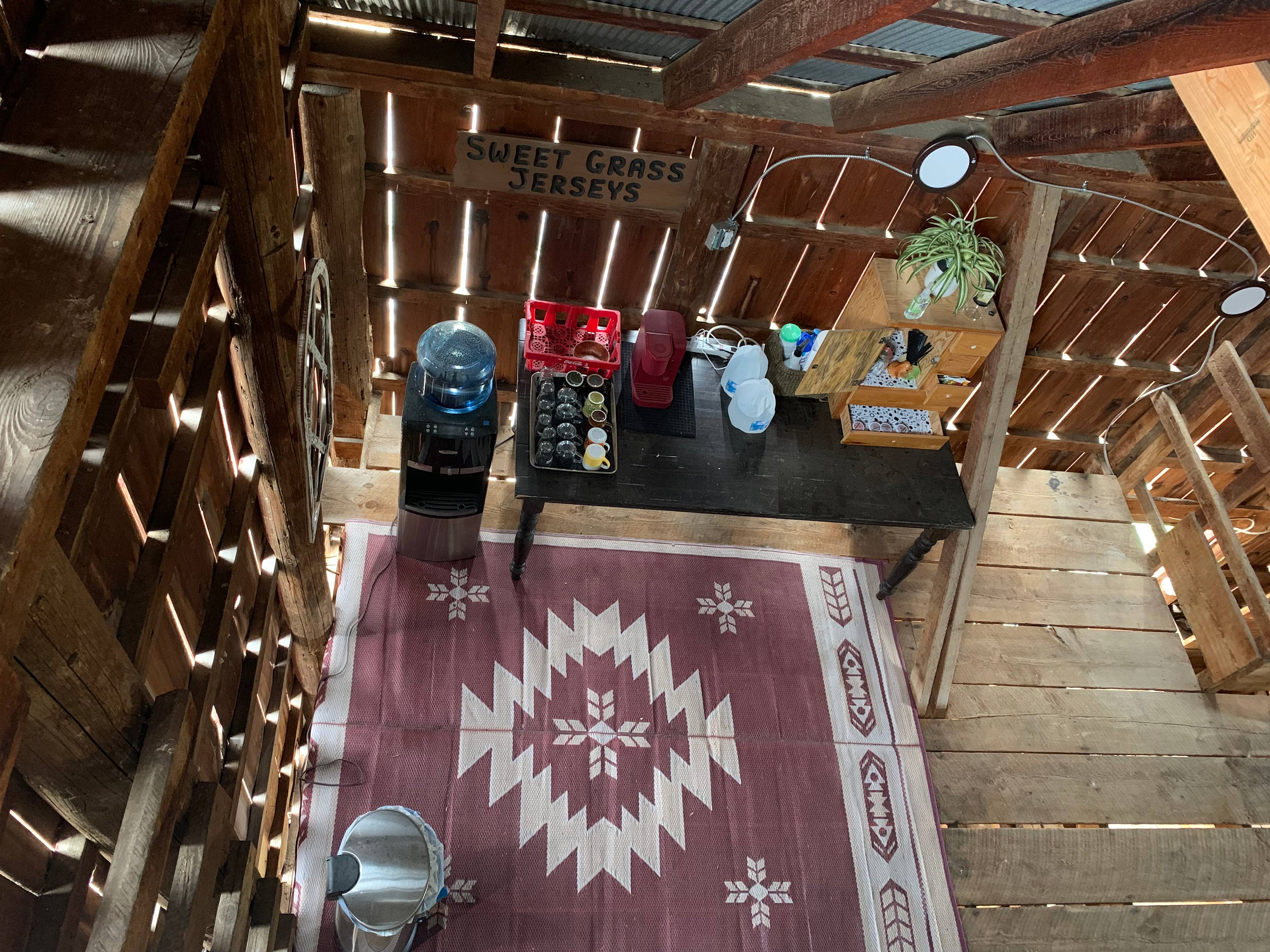 Kitchen with bottled water, kuerig, coffee and accompaniments 