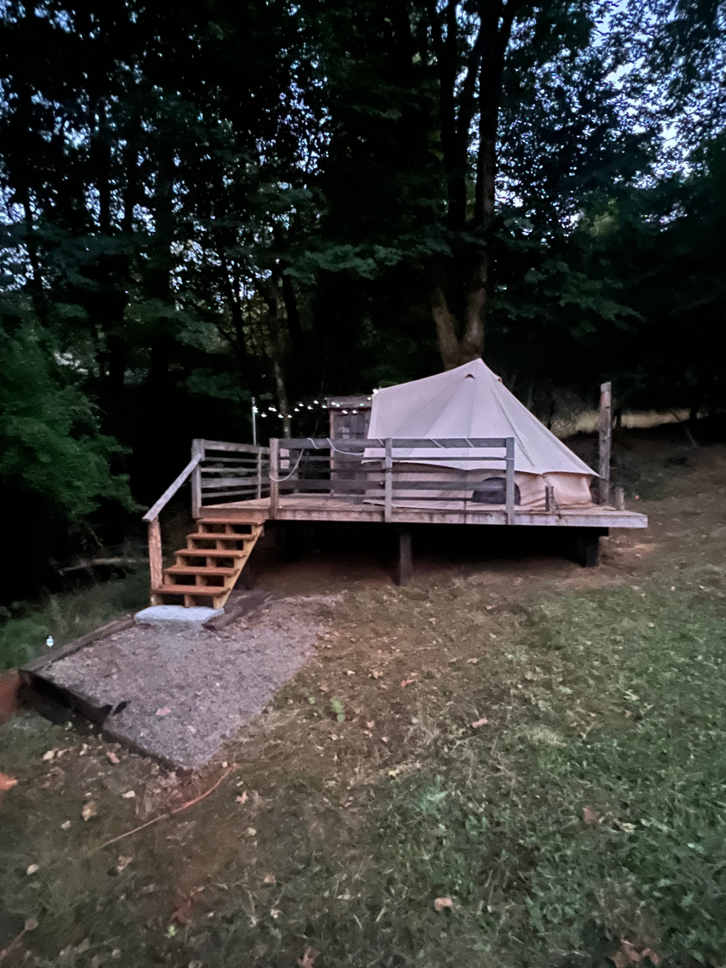 Glamp-ground tent, tucked back in trees. View from back yard of Eclectic City main house...
