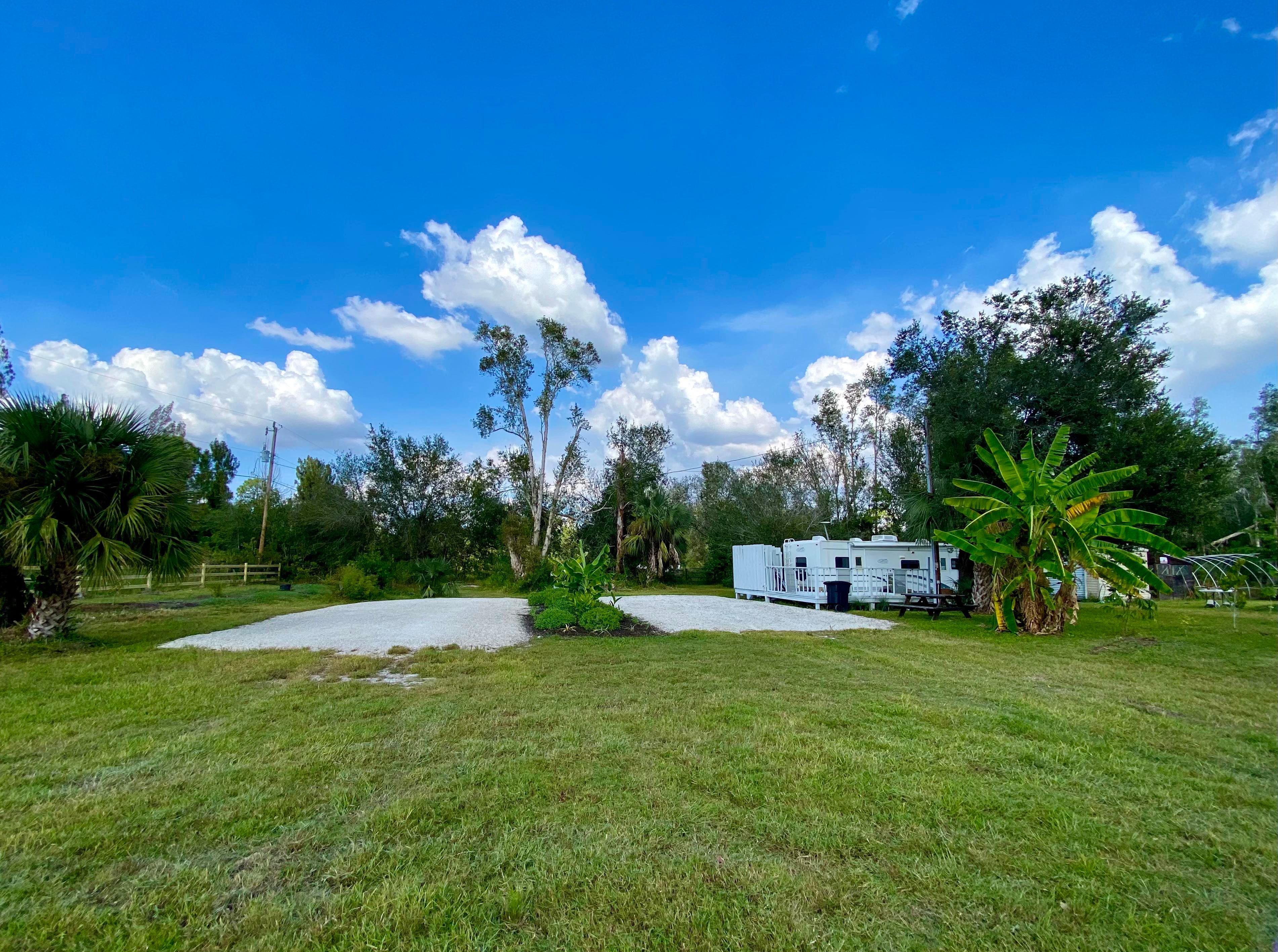 This is a front view of RV Sites #1 and #2. RV Site #1 is on the right (closer to our personal RV) and RV Site #2 is on the left (closer to the road).