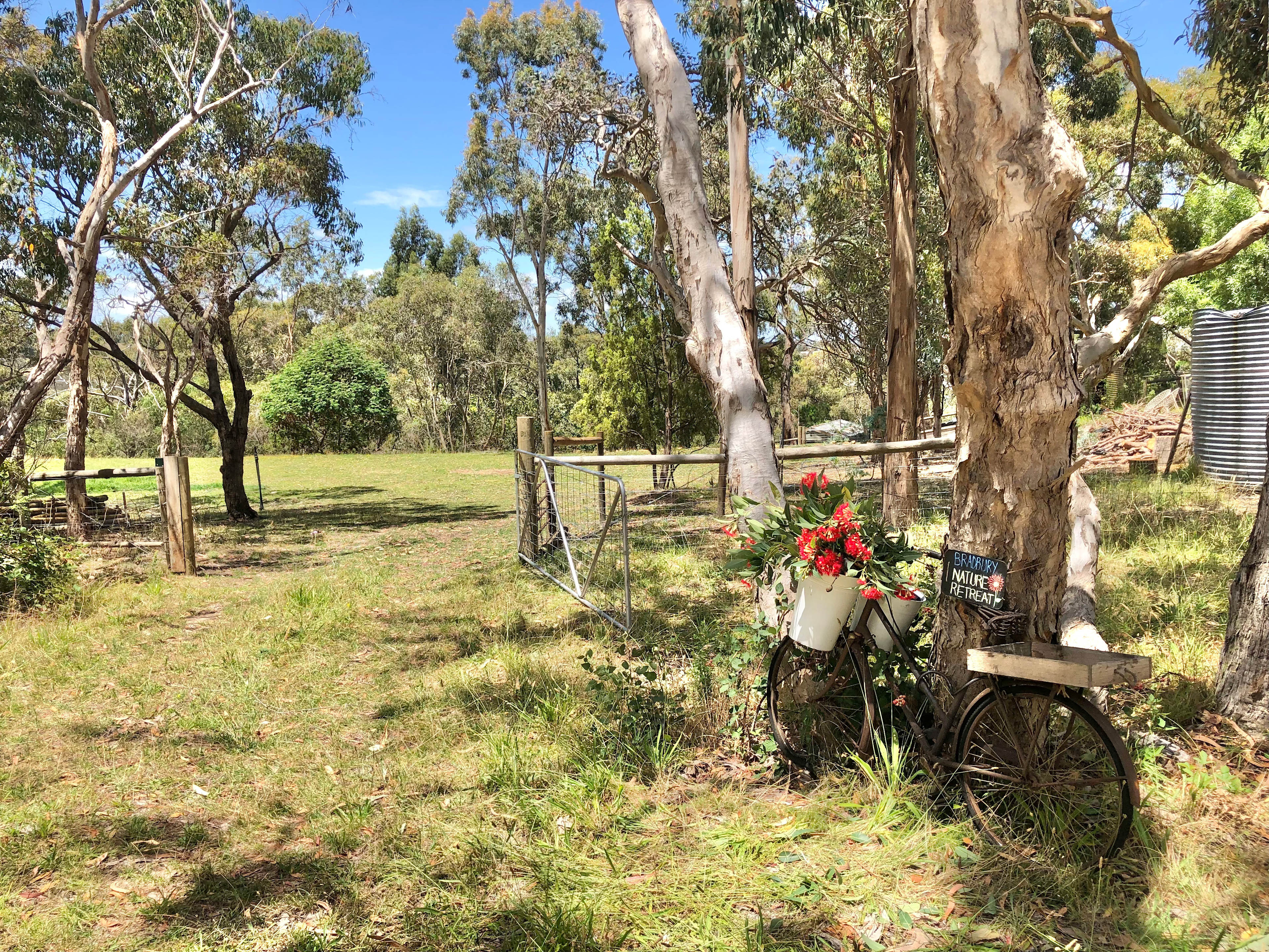 The entrance to the campsite is to the left of the bike.