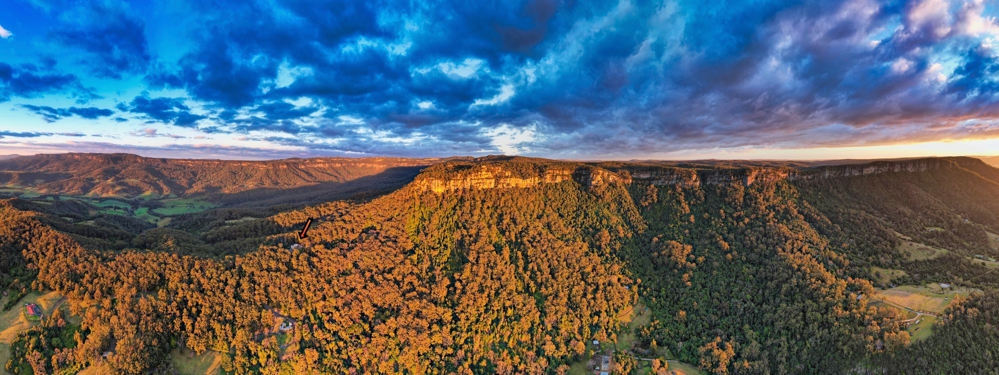 Look for the small orange arrow - it's pointing to the property which sits on a ridge line that leads right to the top of the escarpment.