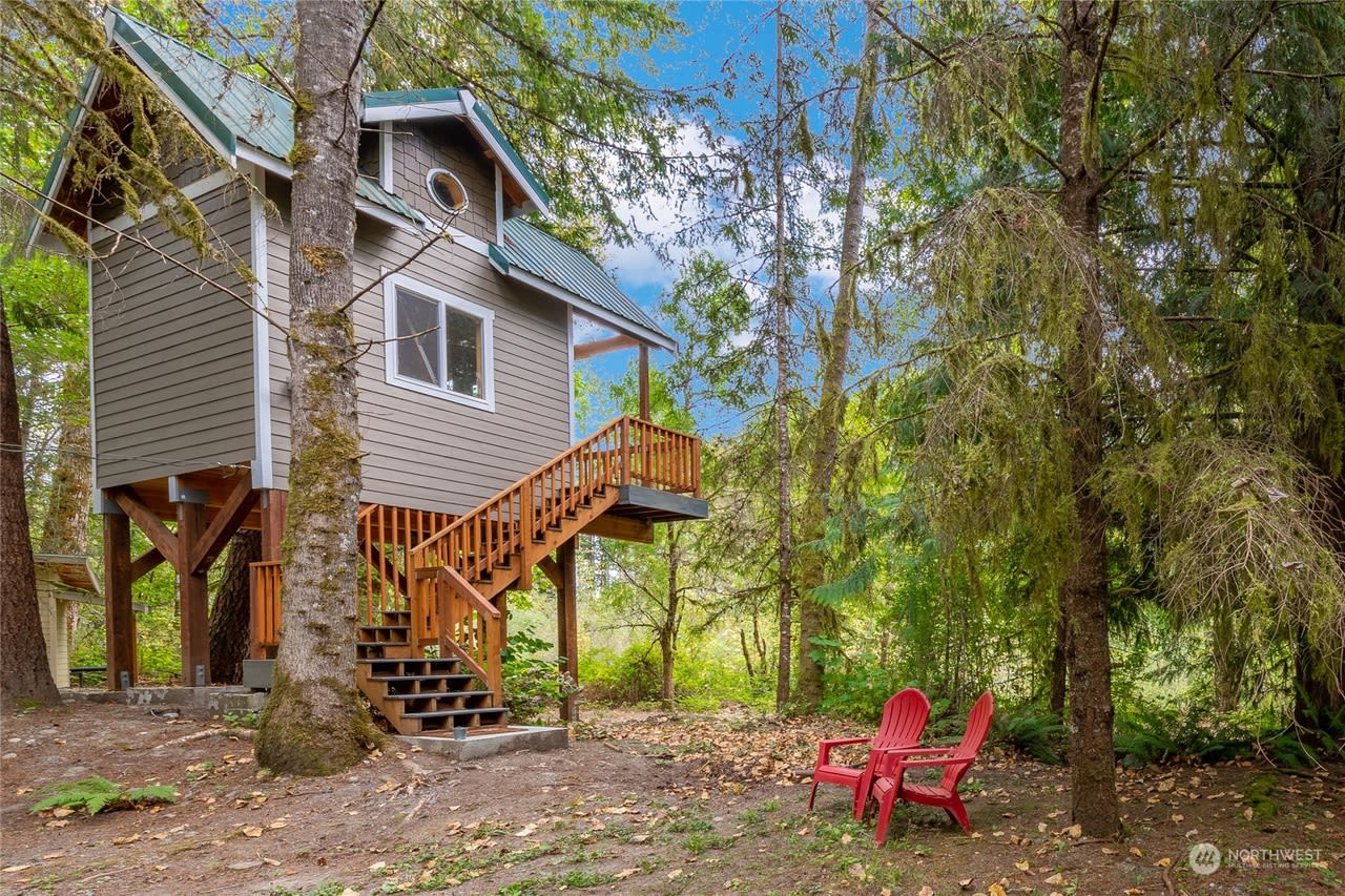 Two story treehouse makes for a cozy couples' retreat but can sleep four.