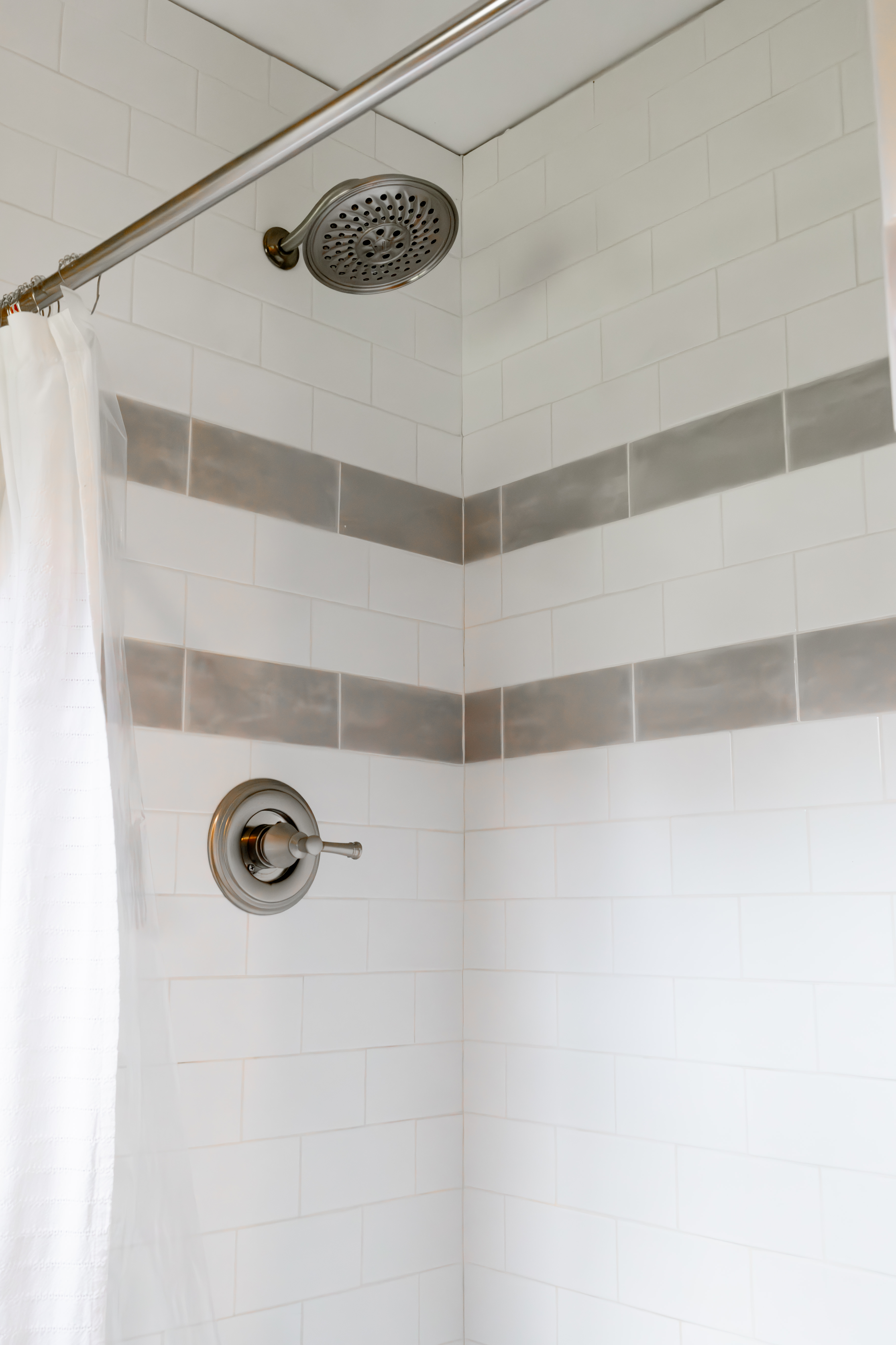 All bathrooms include toilet, showers, and sinks. 