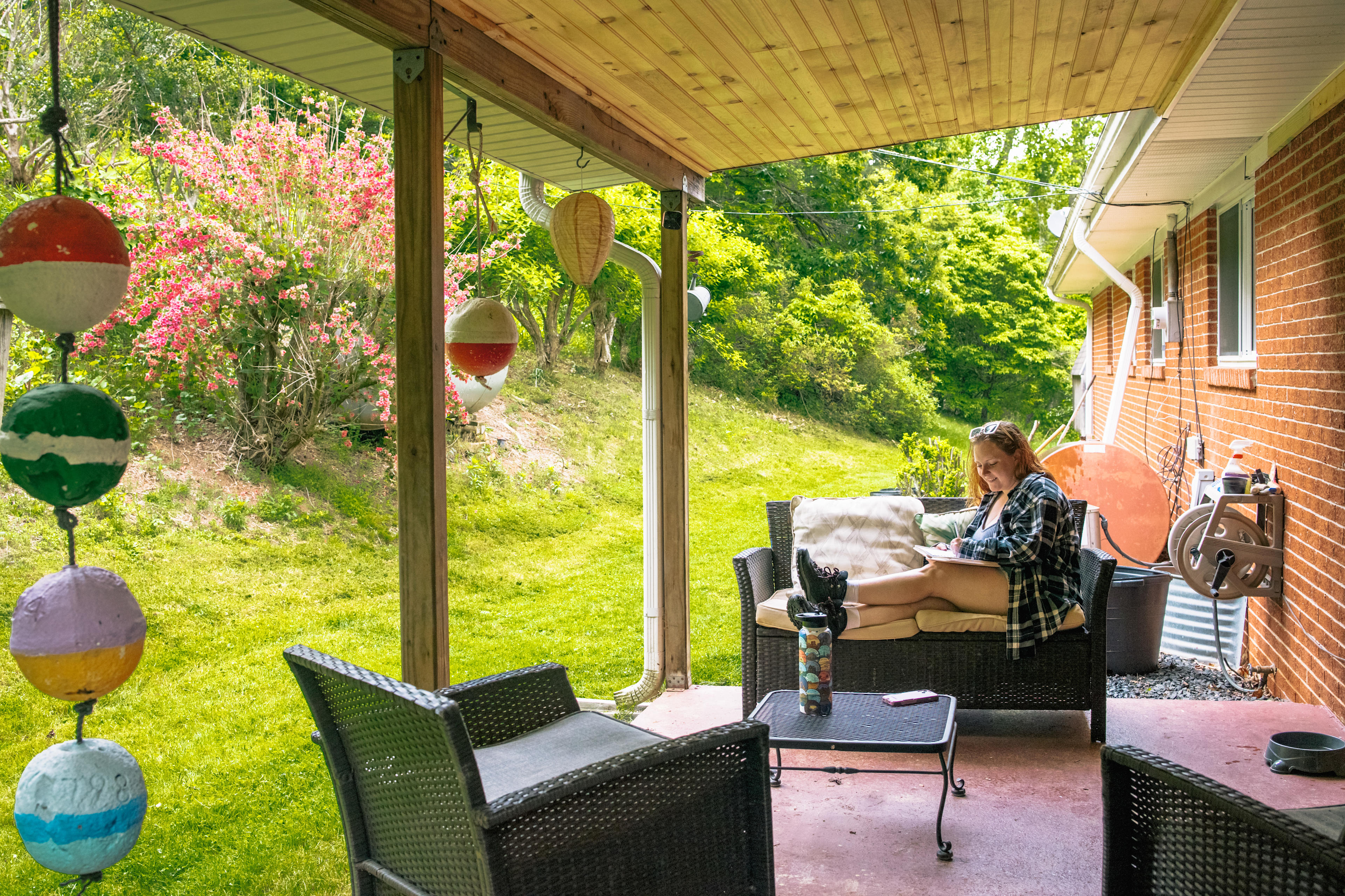 Outback of her home - Michelle offers her back porch as a shared space. It was a nice spot for me to hide from the rain for a bit. 