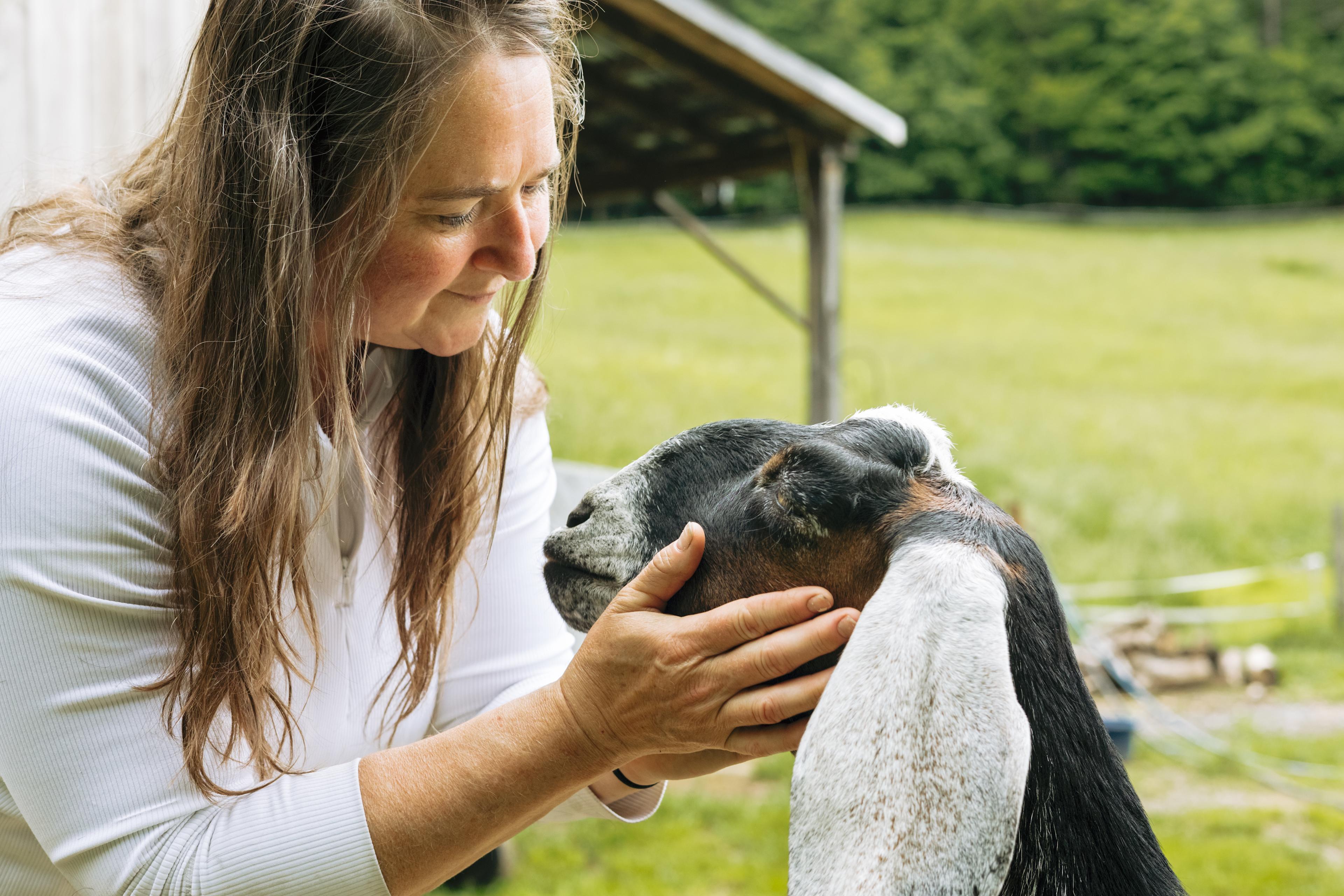 Miken lovin up on the goats. 