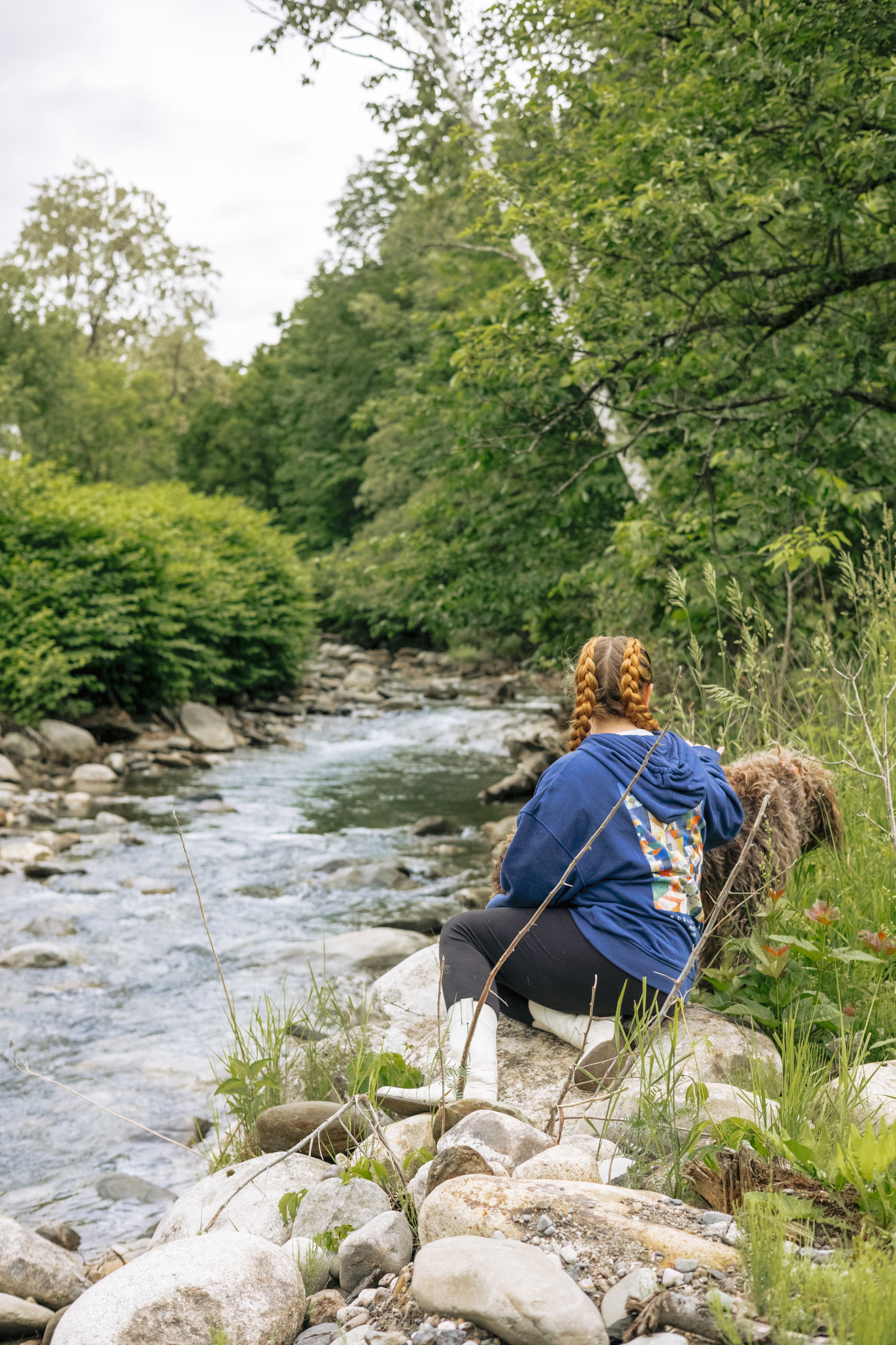 Hangin by the water with one of the dogs on property.