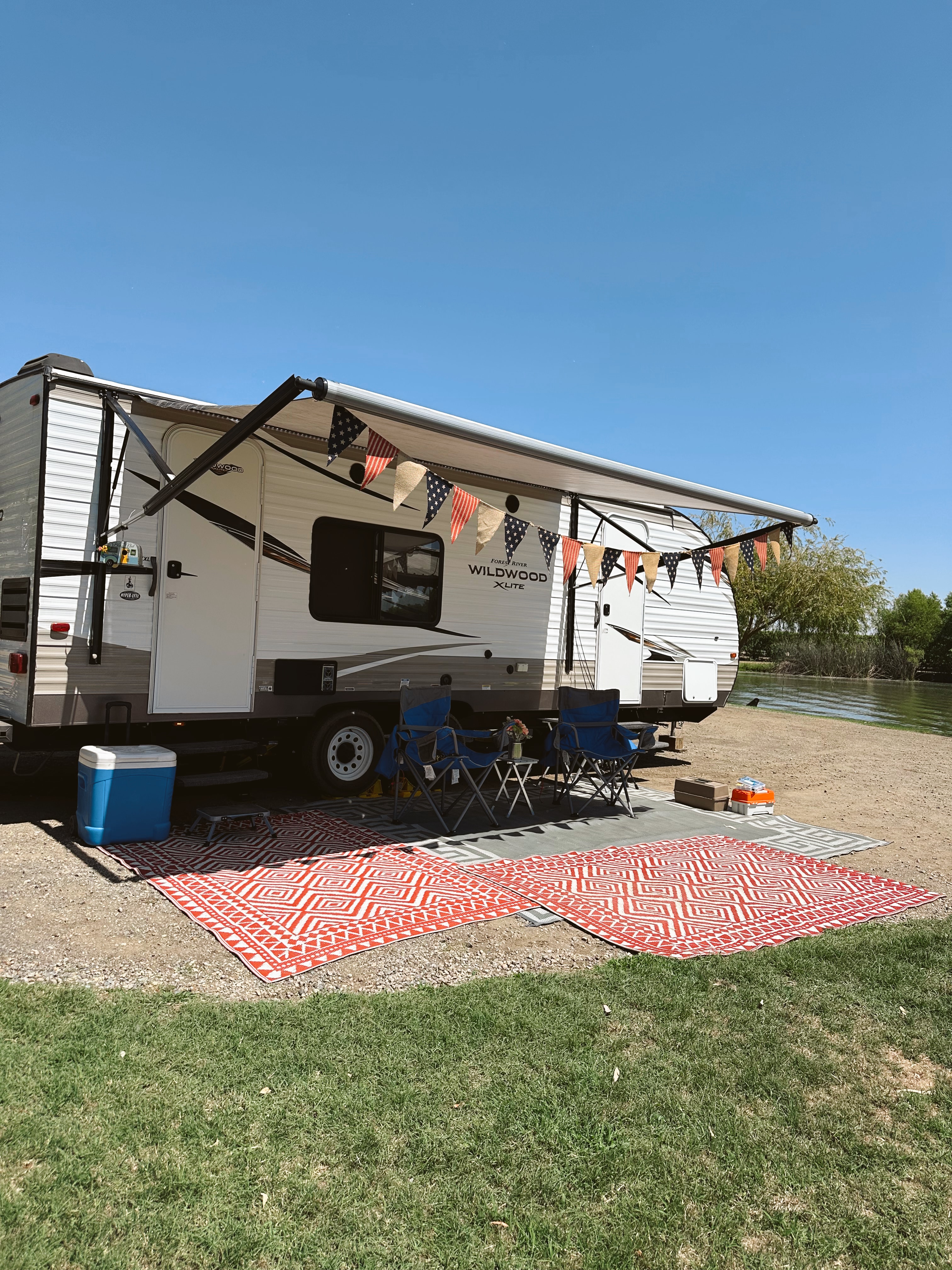 Trailer at the property with the pond in the background.