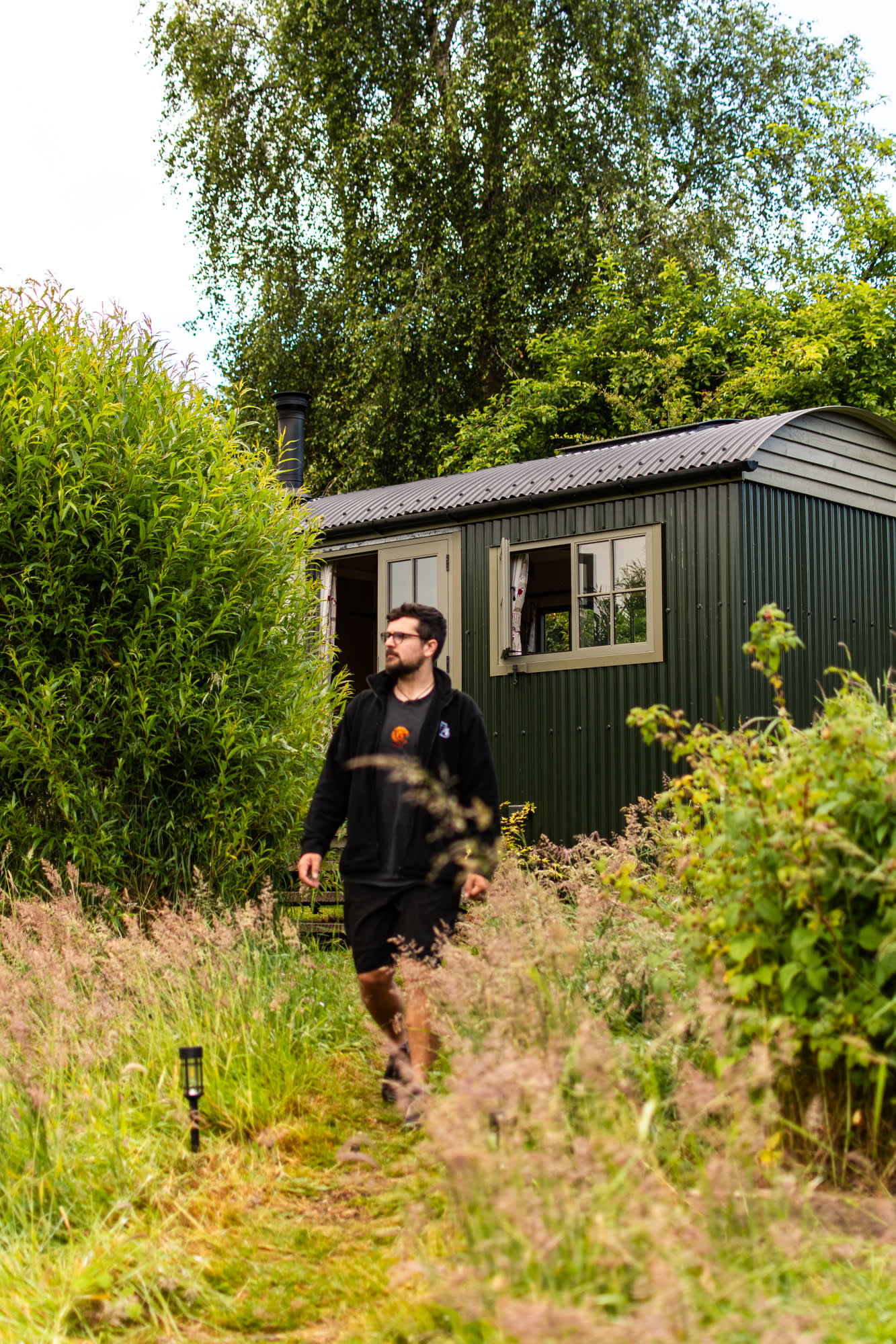 The mown path leading through the wildflowers towards the hut