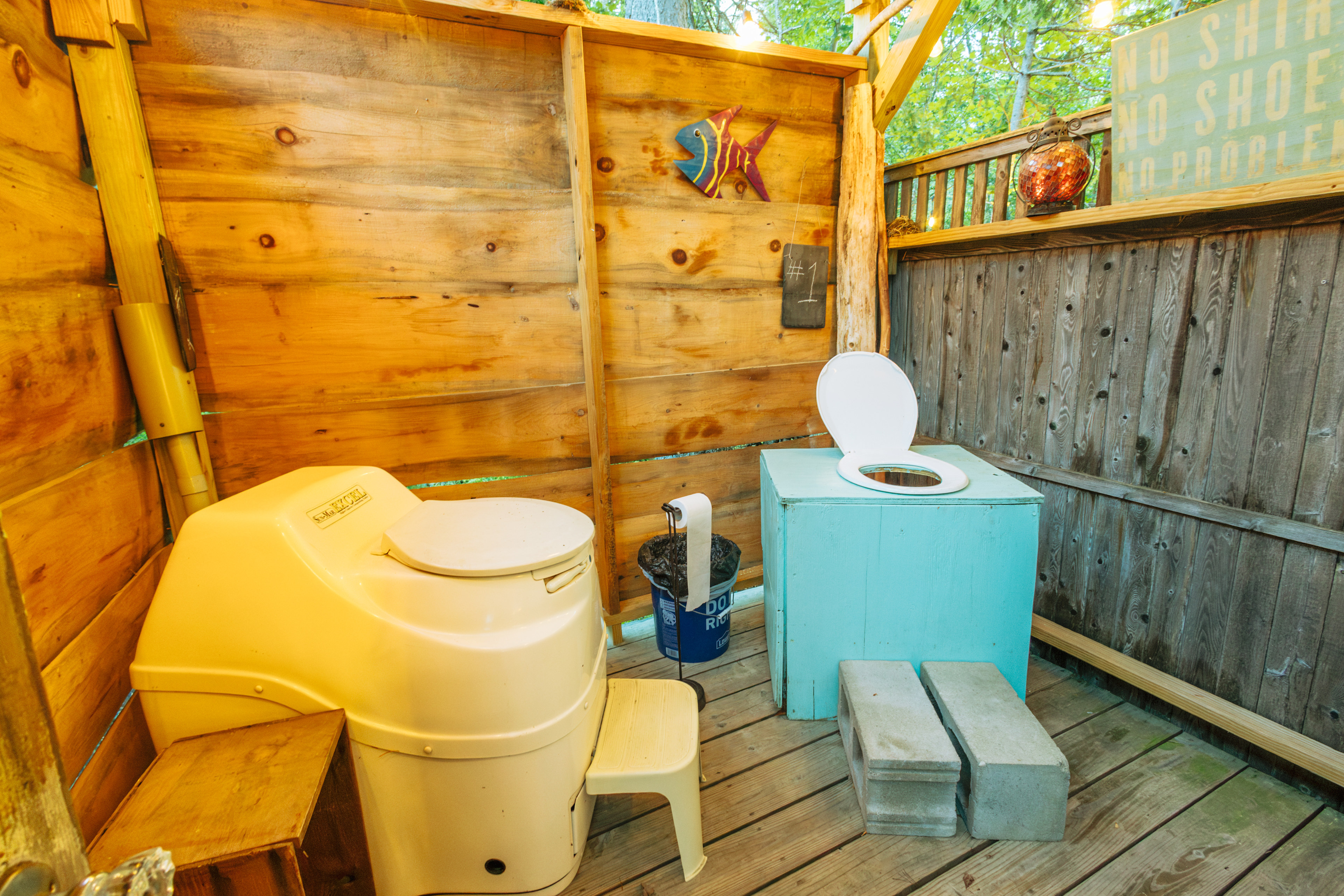 The outdoor bathroom has two toilets for certain occasions and a hot shower.