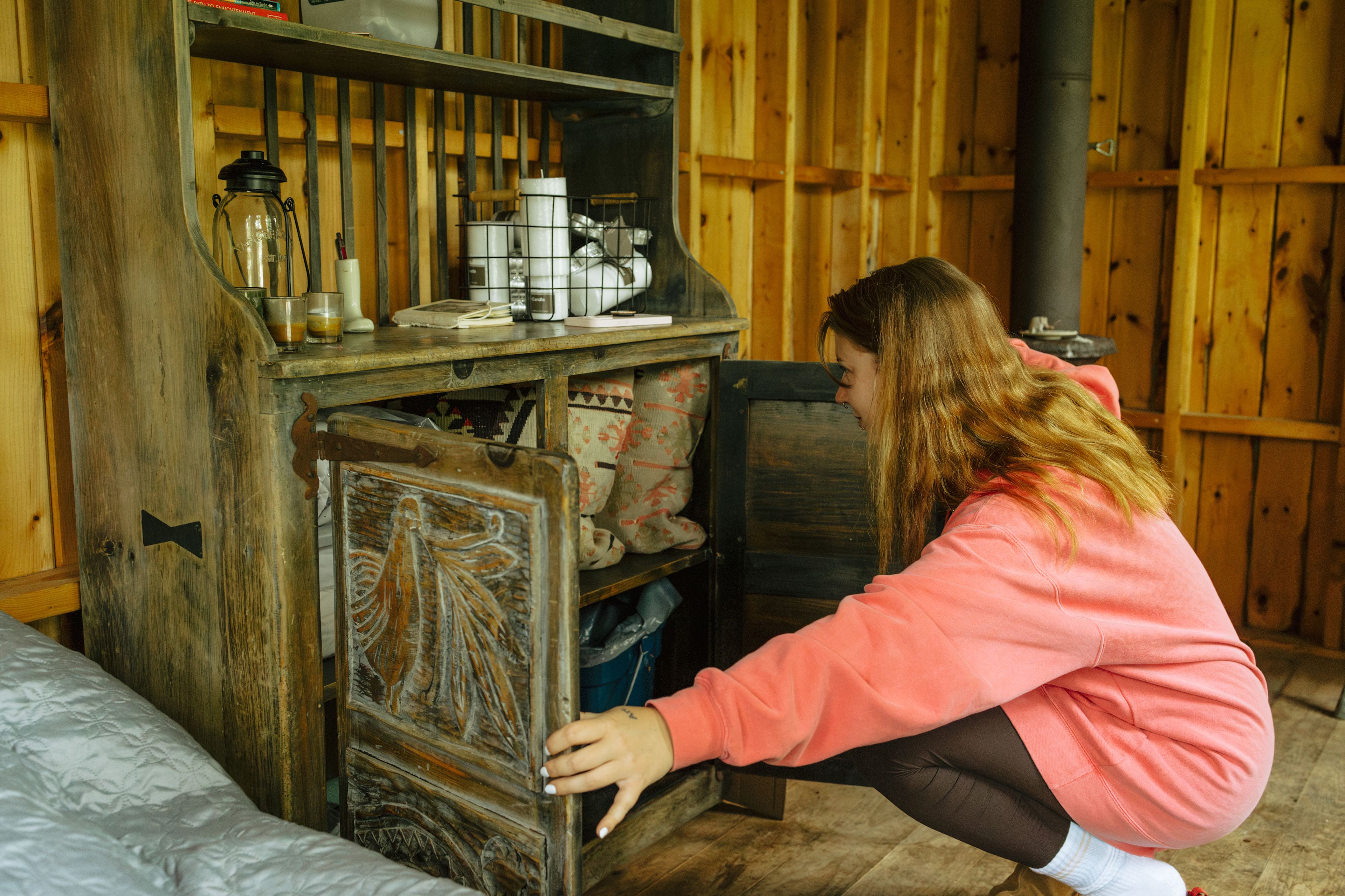 You'll find some basics including matches, more pillows, and trash bags in the cabinet. 