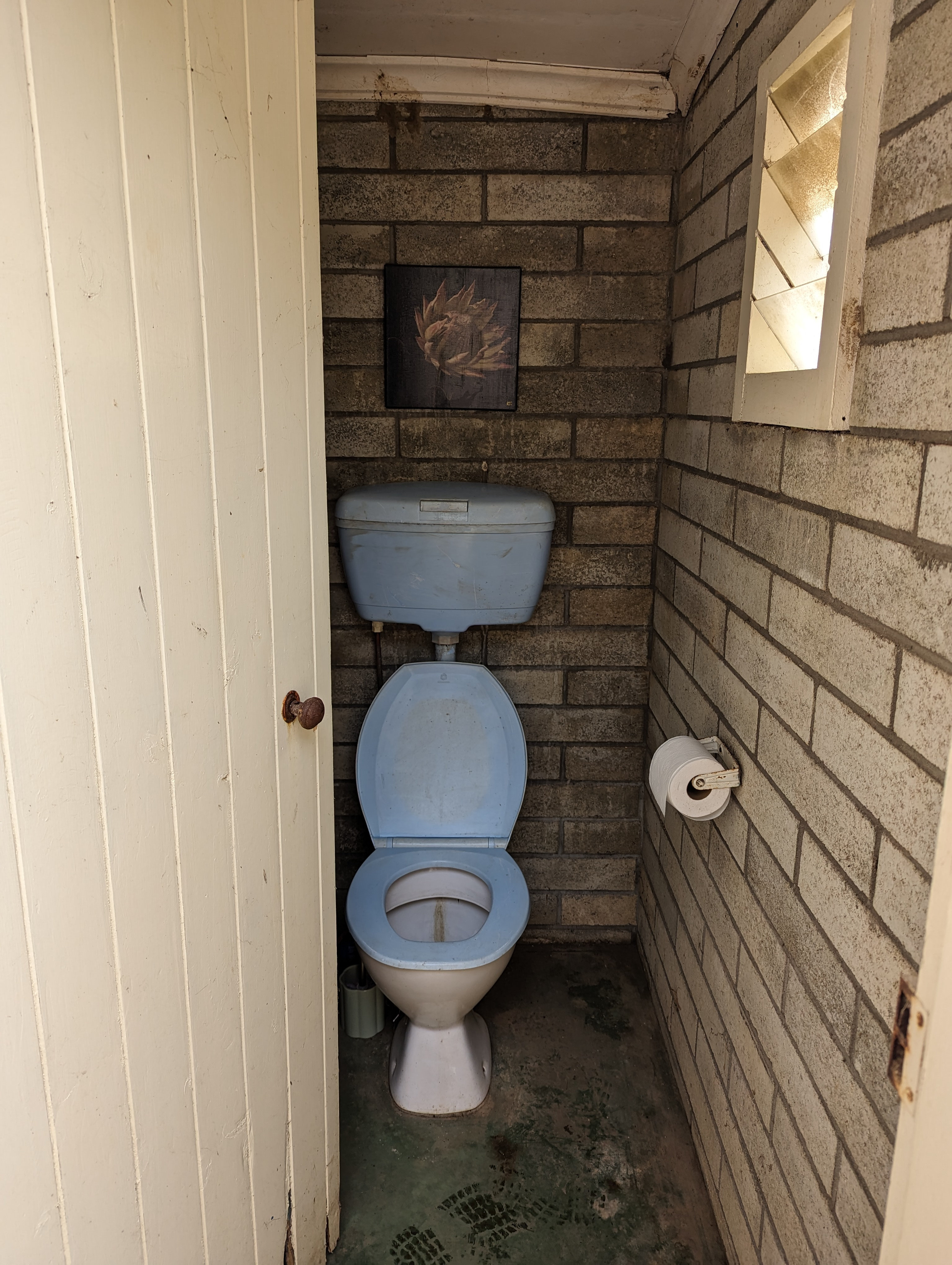 Think old skool vintage Australiana outside loo and here she is! This toilet would have been old even when I was a kid but we have cleaned her up the best we can. She flushes and is a short  wander down the hill towards the main house. Handwashing station located under the veranda adjacent to the outside tap.