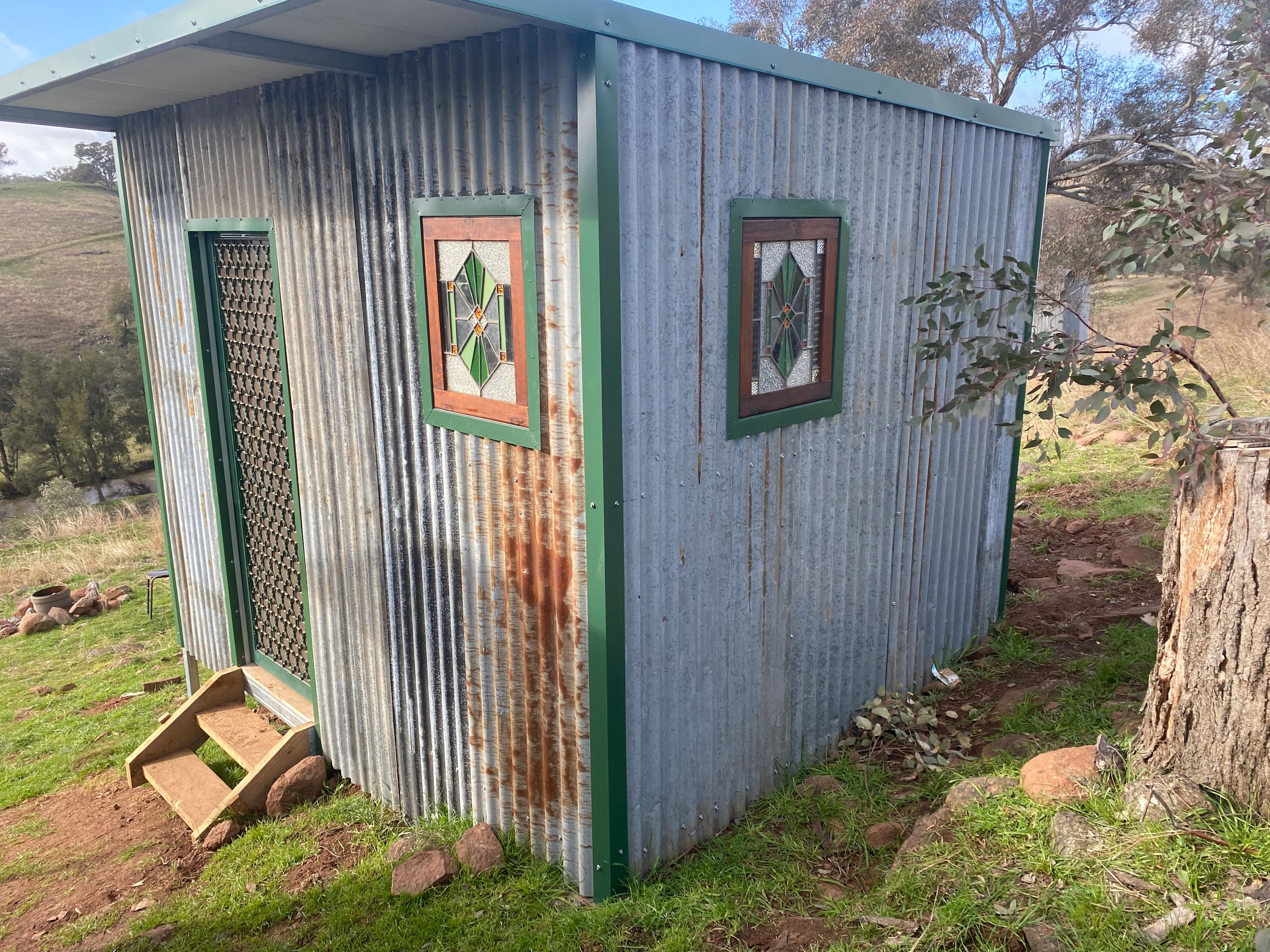 this outhouse adjoins hut.
Inside are cooking facilities and separate shower room