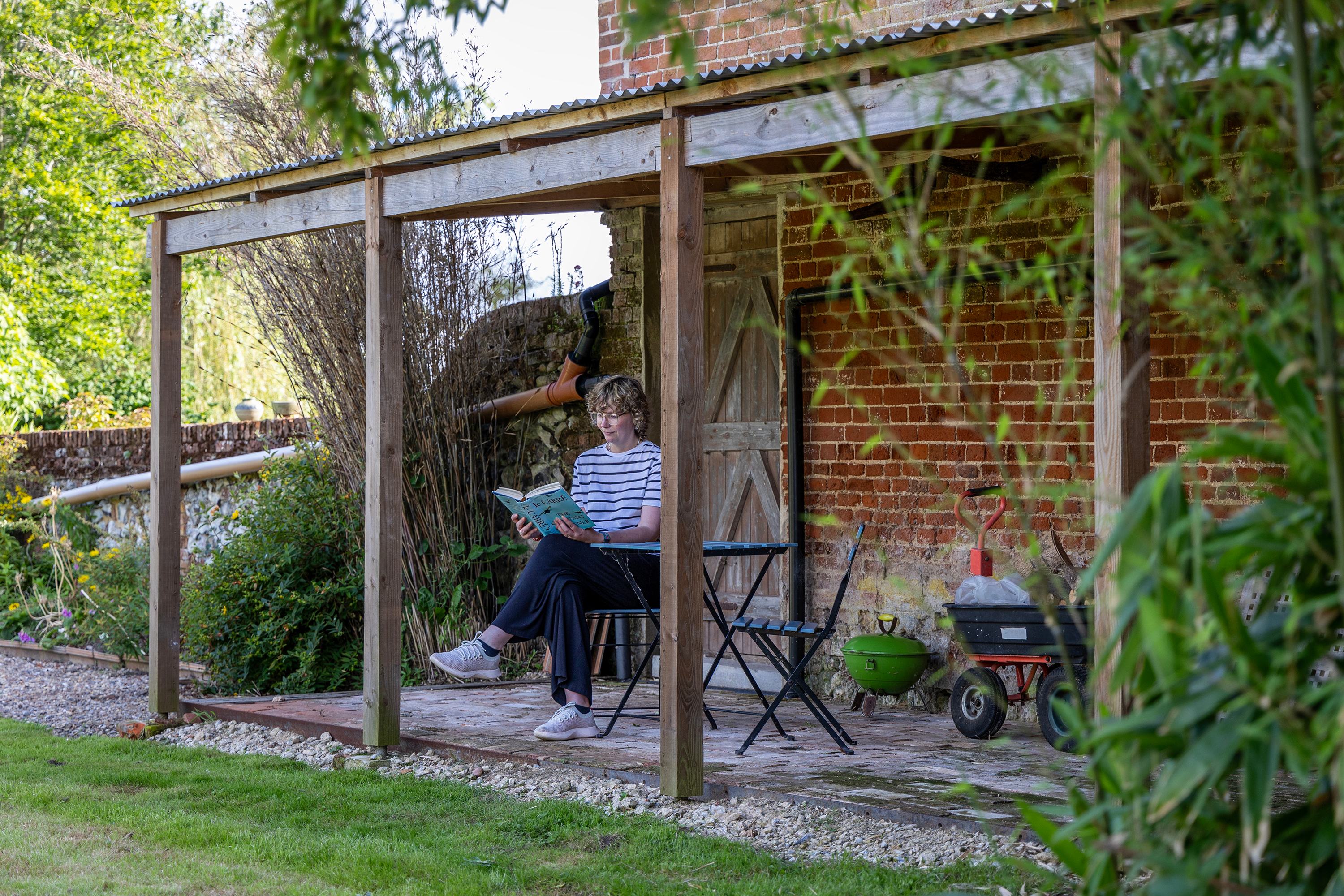 The covered veranda by the barn is the perfect reading spot.